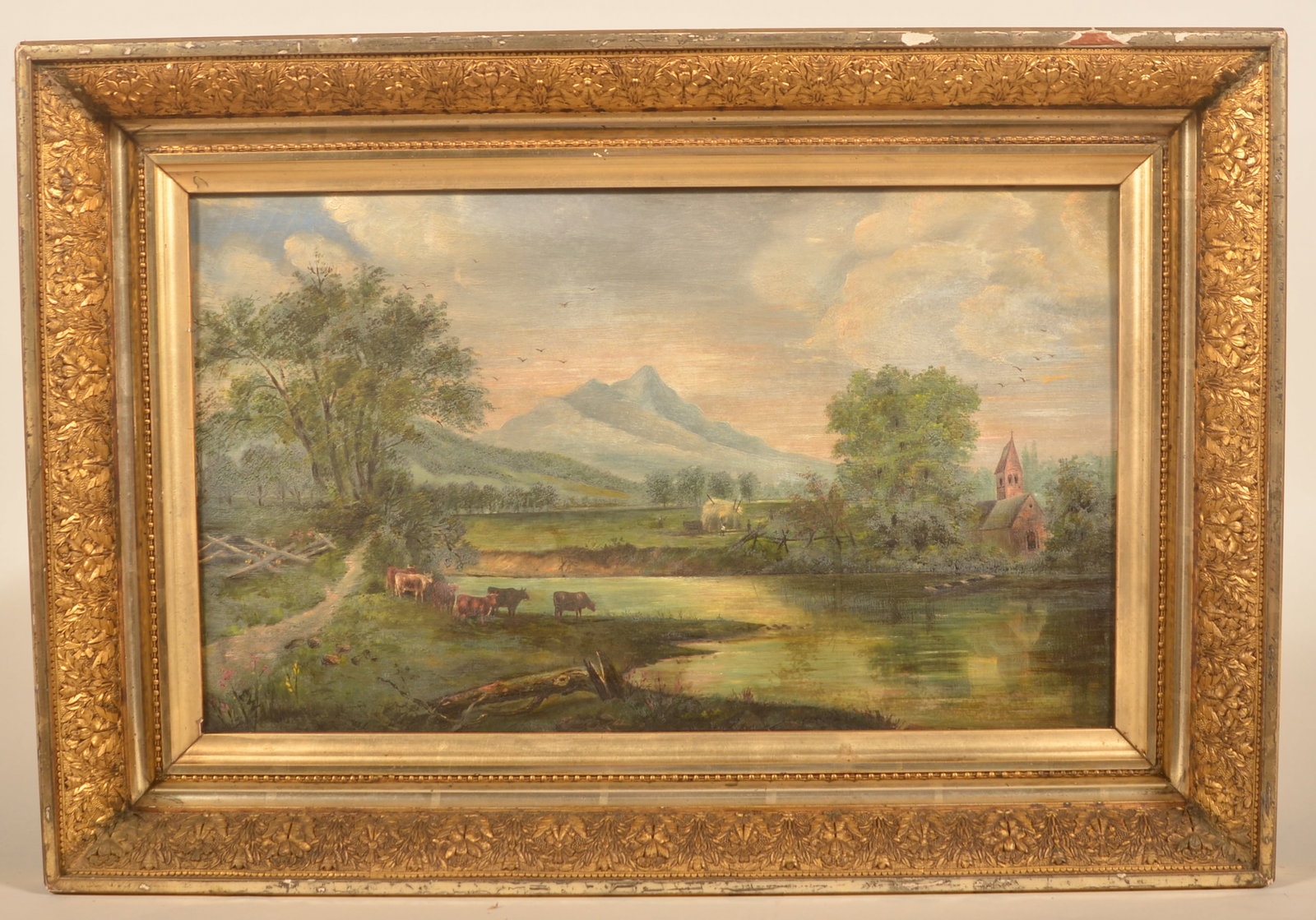 19th C. Landscape Oil on Canvas w/ Gilt Frame: Picturesque painting depicting a stream with livestock, fence line and a church. Unsigned. 18"H x 25"W