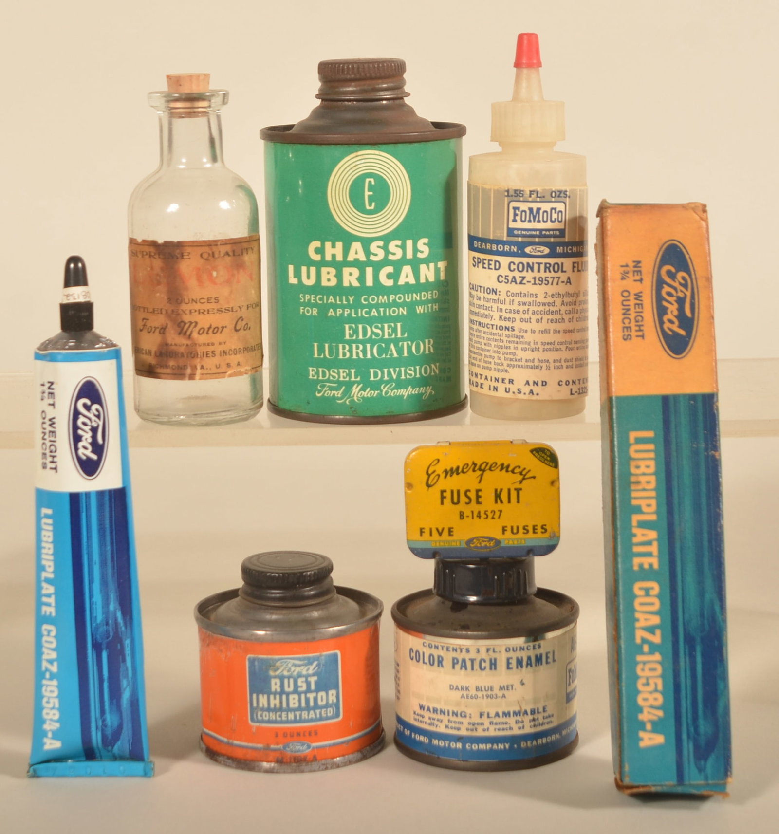 Ford Motor Co. Handy Oilers & Containers: Group of Seven Ford items including an unusual twist top Edsel Chassis Lubricant can in excellent condition, an early cork top, paper label for "Supreme Quality Lemon" oil, two short 3 oz. cans for ru