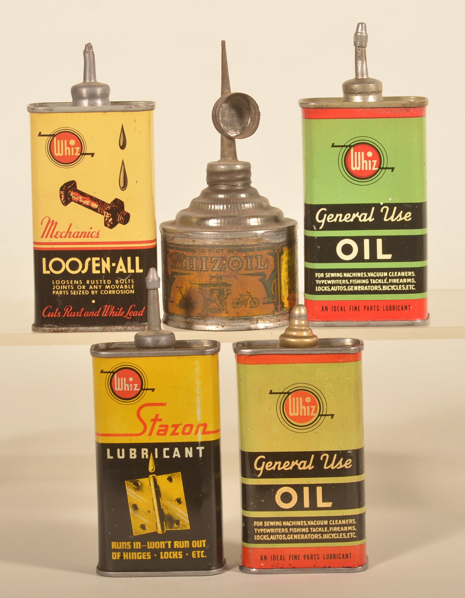 Group of Early Whiz Handy Oilers: Nice collection of five different cans including an early 1/4-pint round can with paper label and four lead top handy oilers. Tallest, 5 1/4"H