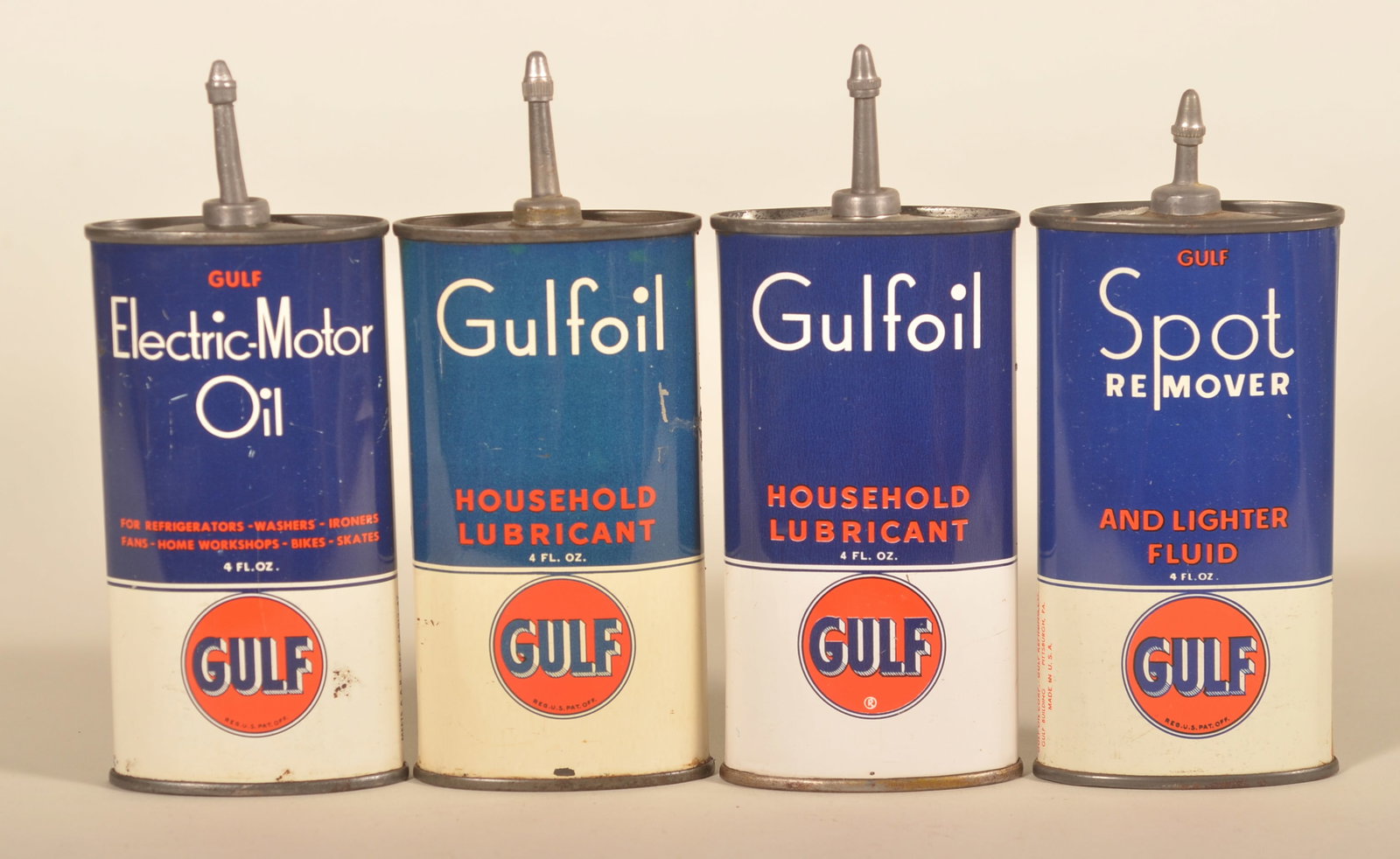 Collection of Lead Top Gulf Handy Oilers: Four different oval lead top oil cans. Electric motor oil, two slightly different household lubricant cans, and a spot remover. 6"H