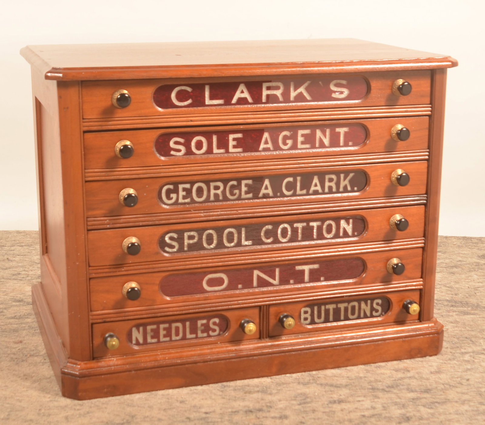7-Drawer Glass Front Clark's ONT Spool Cabinet: This example is in very good condition with the glass drawer fronts intact (most often found with breaks) and an excellent patina to the case. 22 1/2"H x 29"W x 19"D
