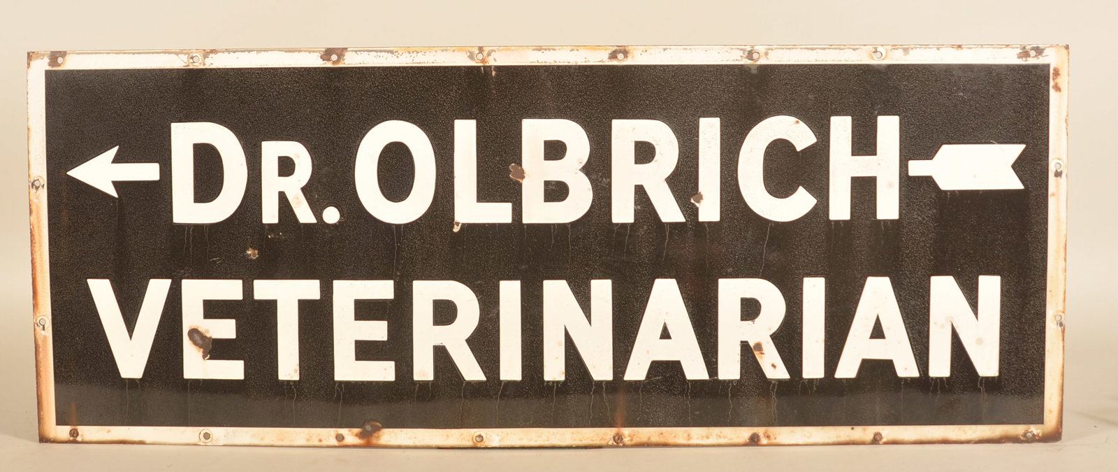 Vintage Porcelain Dr. Olbrich Veterinarian Sign: Black and white single-sided porcelain sign with directional arrow. Found in New England. 16"H x 41 3/4"W