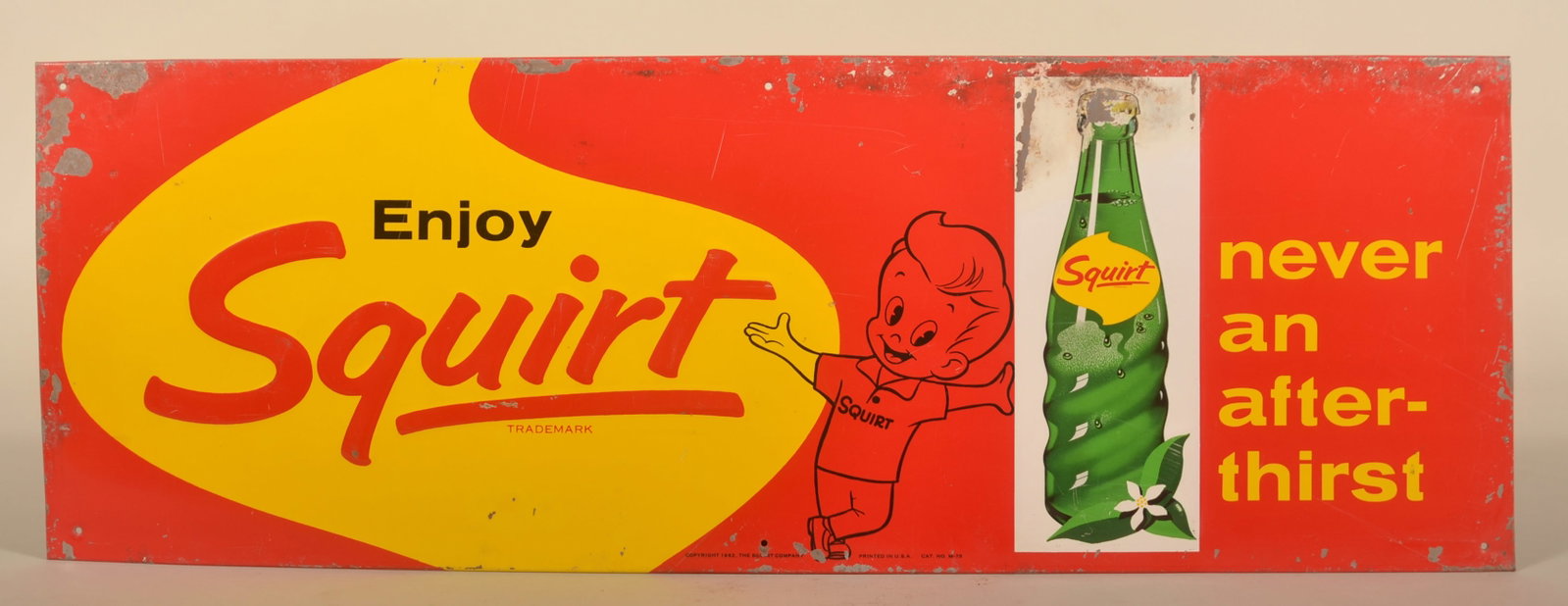 Embossed Squirt Single-Sided Soda Sign: Small metal sign featuring the Squirt logo leaning on a bottle with "never an after-thirst". Marked on bottom "Copyright 1952 The Squirt Company Printed in USA Cat No. M-78". 9 1/2"H x 27 1/2"W