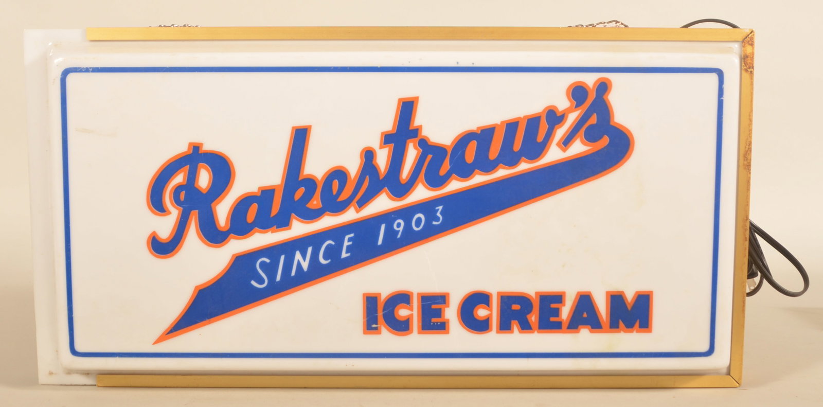 Rakestraw's Backlit Advertising Ice Cream Sign: Metal body with plastic lense with maker's label "Mulholland Harper Company". Rakestraw's is located in Mechanicsburg, PA. 12 1/4"H x 24 1/2"W