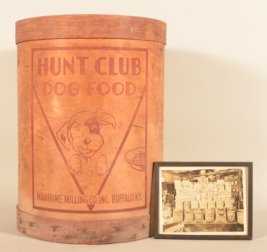 Vintage "Hunt Club Dog Food" Advertising Barrel: Great, large wood barrel with stenciled decoration depicting a smiling puppy. Added to the group is a framed, period black and white photo of the interior of a feed store showing a massive display of