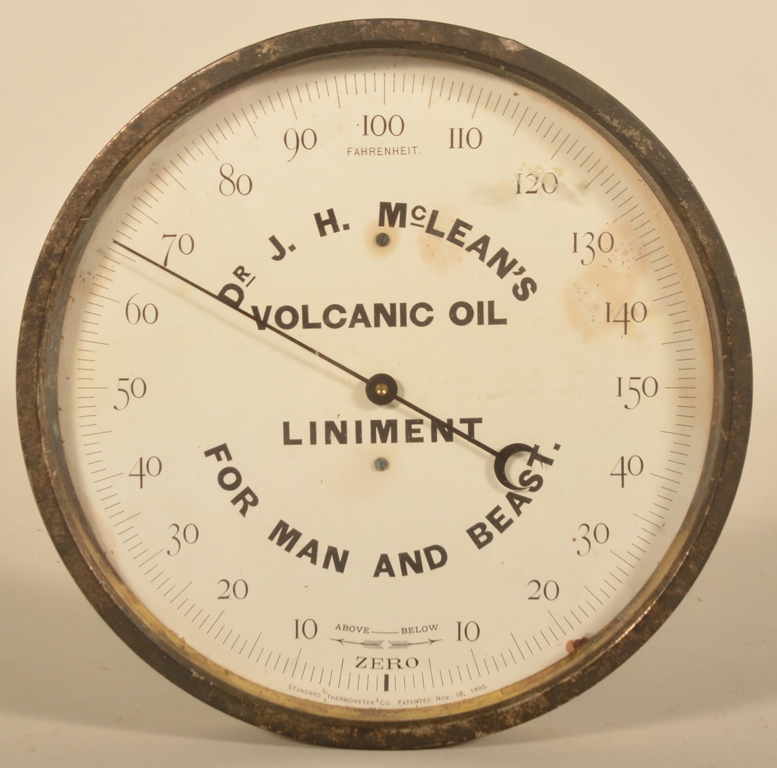 Dr. McLean's Volcanic Oil Advertising Thermometer: Interesting early round thermometer with advertising for Dr. J.H. McLean's Liniment for both man and beast. Accurate temperature. 9"D