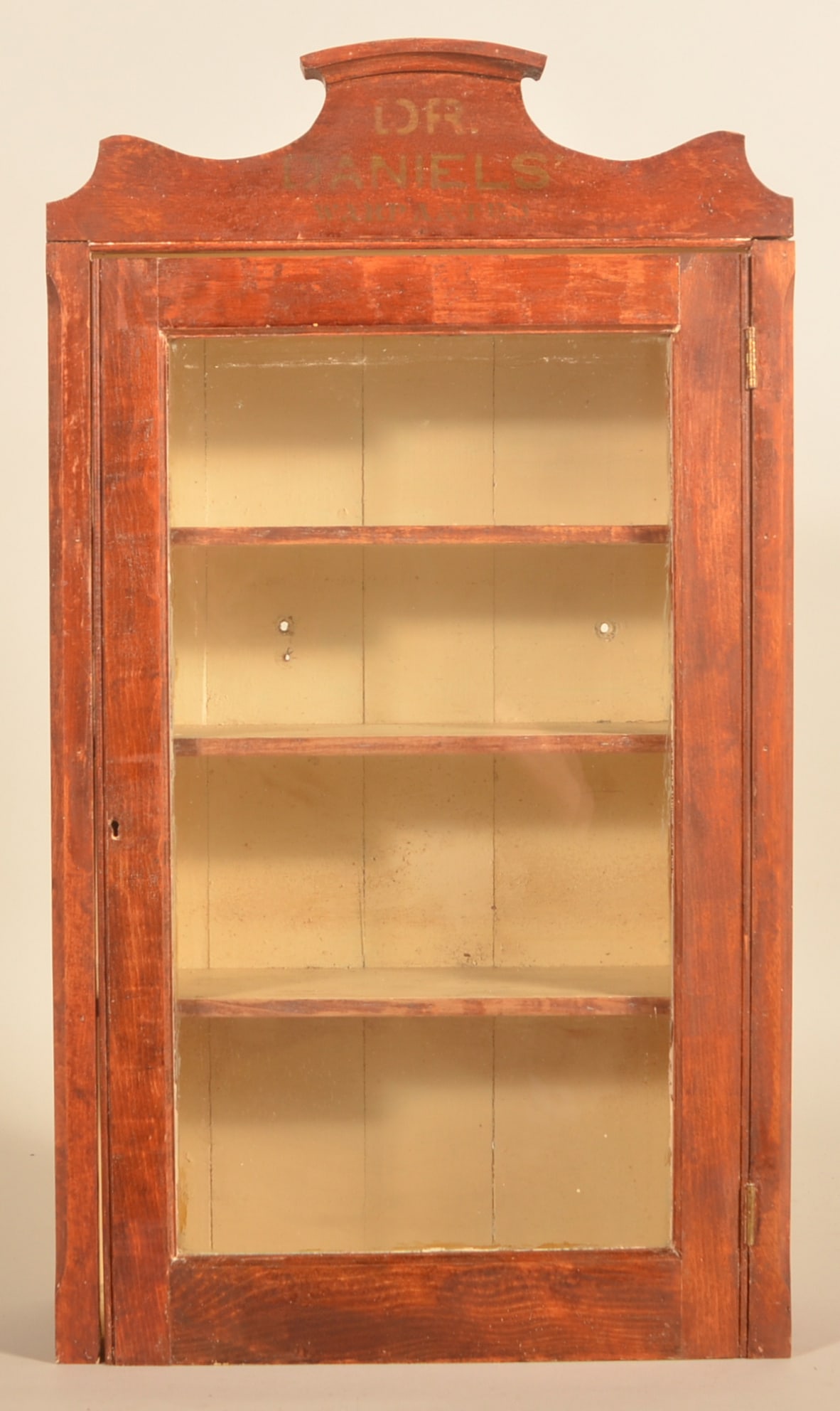 Dr. Daniels' Glass Front Veterinary Cabinet: Another early example of the 1st generation cabinet. This cabinet is a rarer variation with gold stenciling on the marquee "Dr. Daniels Warranted" and a heavy cherry finish to the wood. Original