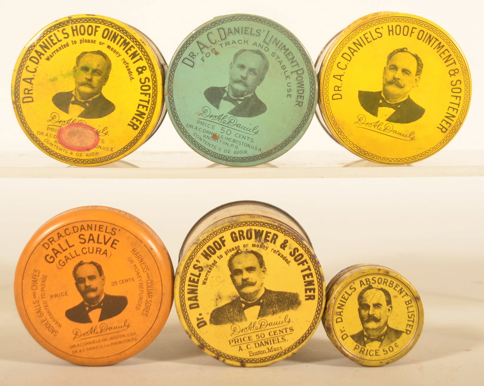 Collection Dr. Daniels' Vet Advertising Tins: Six different tins include three variations of the Hoof Ointment, a blue Liniment Powder, round Gall Salve and a small Absorbent Blister. Largest, 2 1/2"H x 3"D