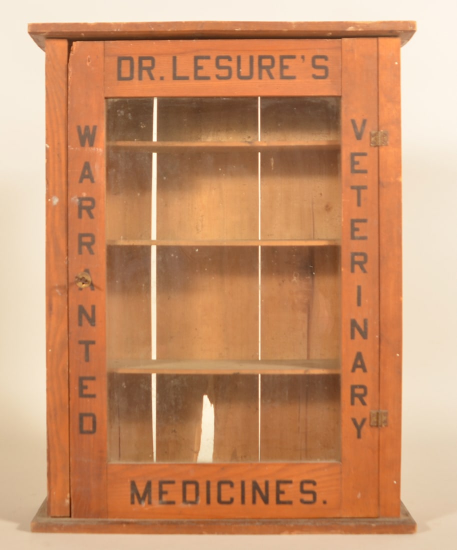 Dr. Lesure's Veterinary Medicines Cabinet: Another excellent example of an early glass front cabinet that was made in the late 19th century and later replaced with the tin front version with the smiling horse. This cabinet is all-original