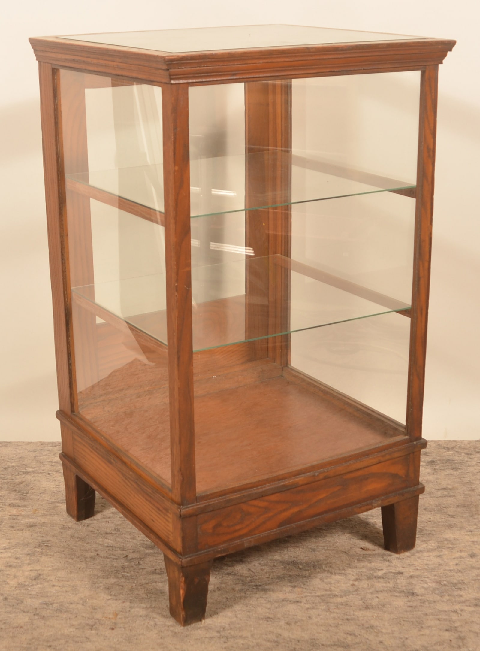 Oak & Glass Country Store Floor Display Case: Antique display case with two interior shelves and rear door. Very nice display. Provenance: The collection of Linda and the late Ed Althouse. 39 1/2"H x 22 3/4"W x 21"D