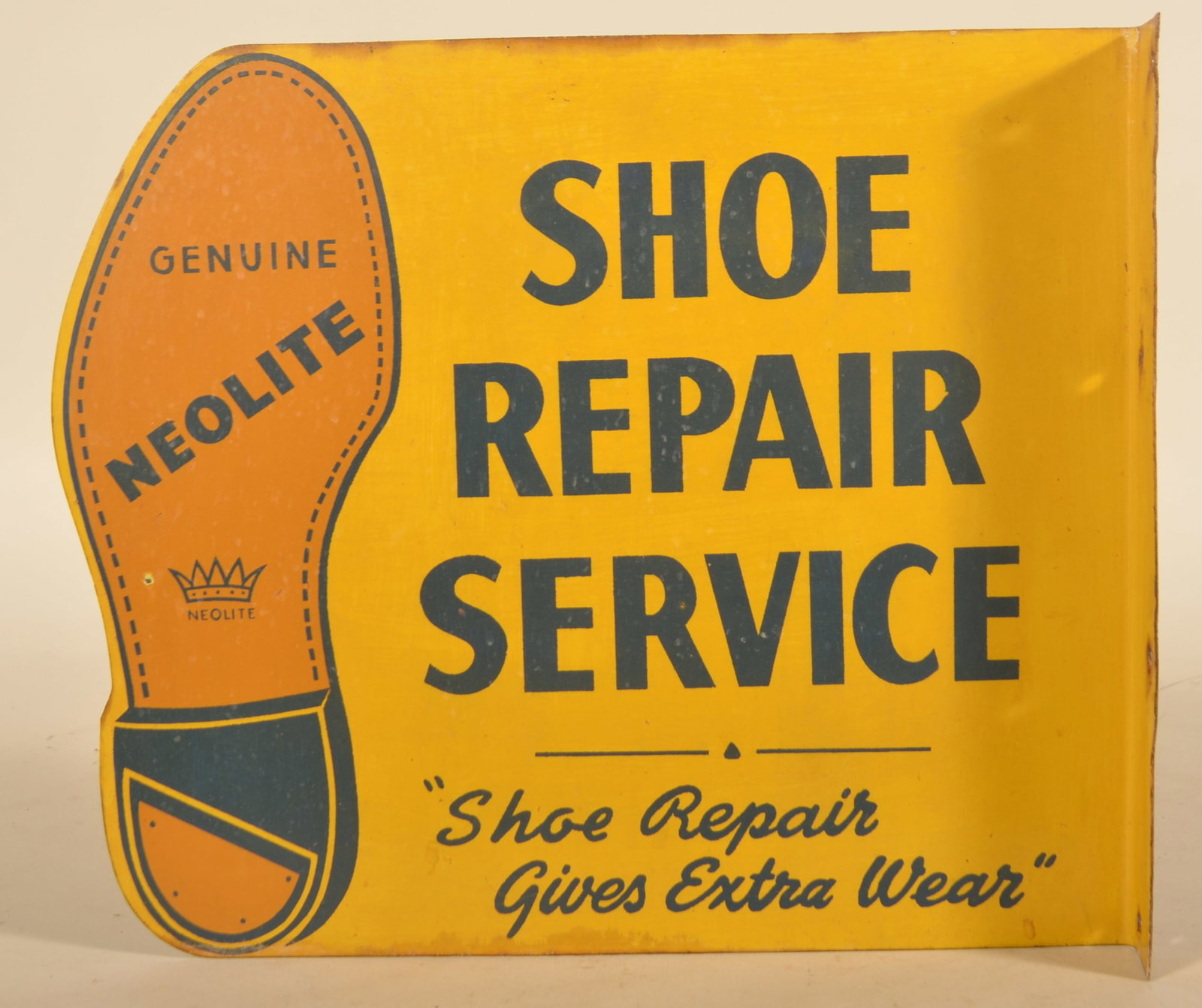Neolite Shoe Repair Service Vintage Flange Sign: Metal, double-sided flange sign advertising Genuine Neolite with the slogan "Shoe Repair Gives Extra Wear". Provenance: The collection of Linda and the late Ed Althouse. 12"H x 14"W