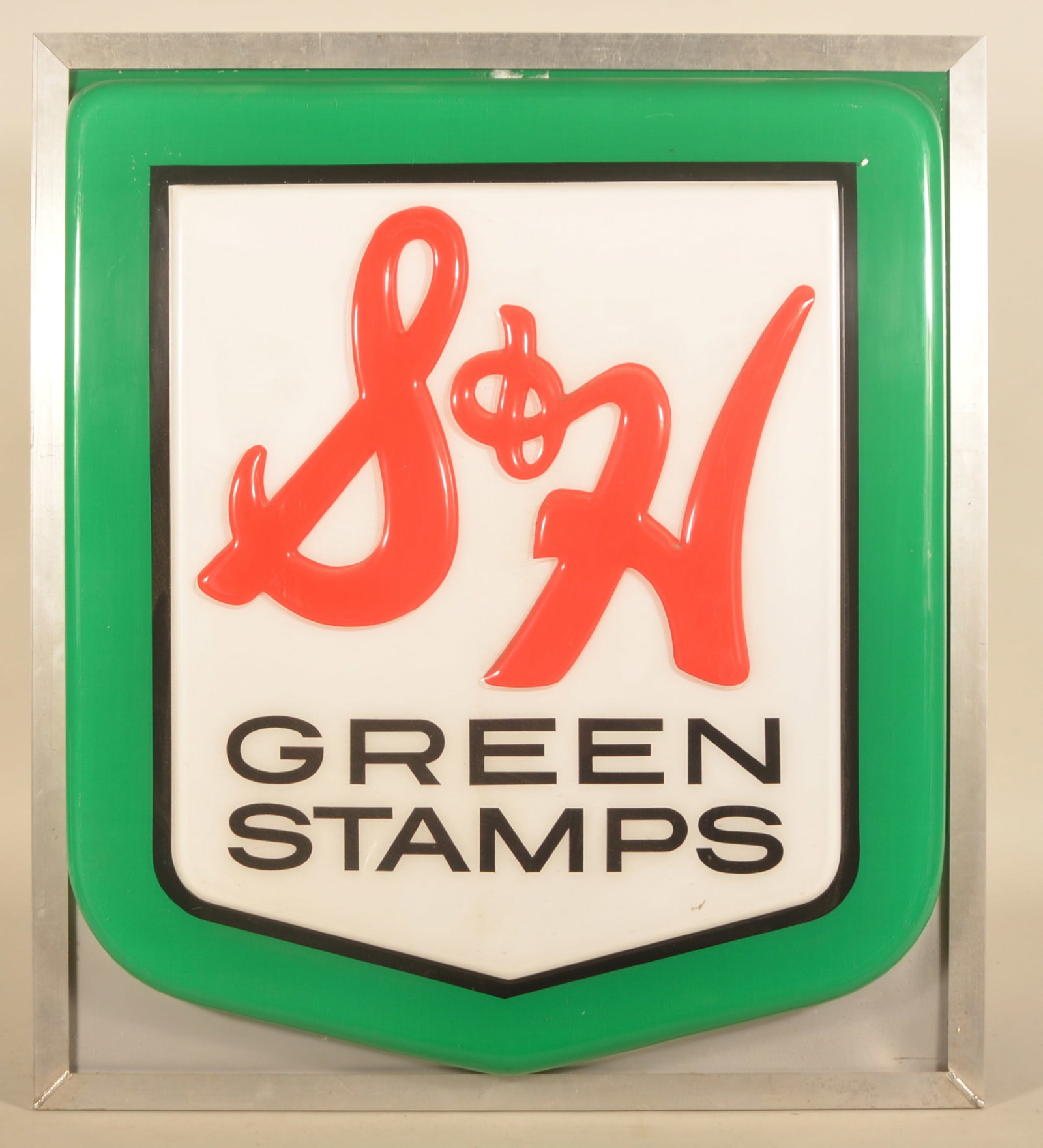 S & H Green Stamps Embossed Sign Cover: Plastic sign cover with metal frame from back-lit sign. Marked "Property of Sperry Hutchinson Company" on base. Bright colors. 37 1/2"H 33"W