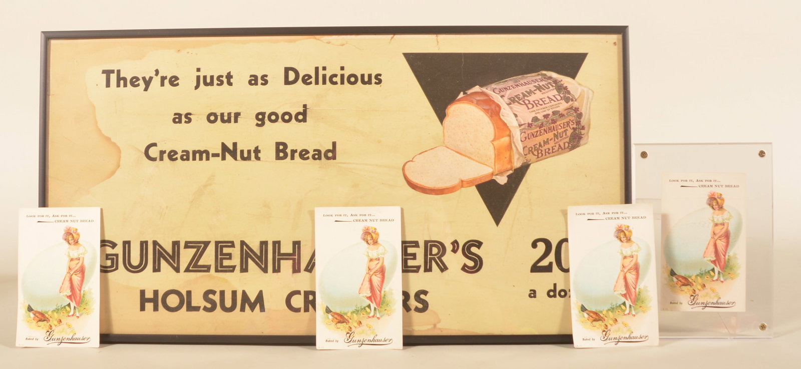 Gunzenhauser's Advertising Window Card & Paper Ads: Framed window card advertising Holsum Crullers together with four paper advertisements (one framed) for Cream Nut Bread. Provenance: The collection of Linda and the late Ed Althouse. Window card, 11 1