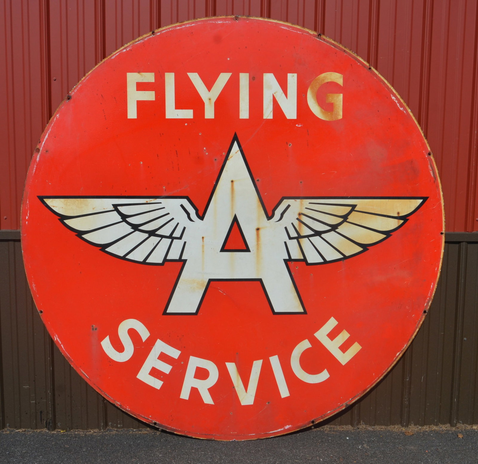 72" Double-Sided Porcelain Flying A Service Sign: Imposing size at 6' in diameter with great color. The winged Flying A was the logo for the Associated Oil Company, founded in 1906 on the West Coast. Today it is owned by ConocoPhillips. Double-sided 