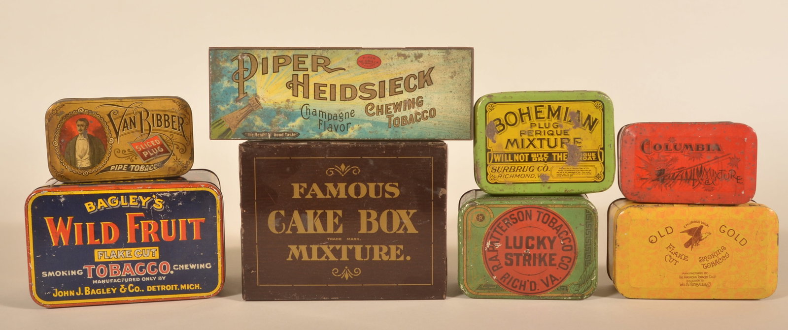 Collection Antique Tobacco Tins Incl. Wild Fruit: Group of tobacco tins including a large Cake Box Mixture, colorful Bagley's Wild Fruit, Old Gold, early Columbia Mixture, Lucky Strike, Van Ribber, Bohemian and a large square corner Piper Heidsieck. 