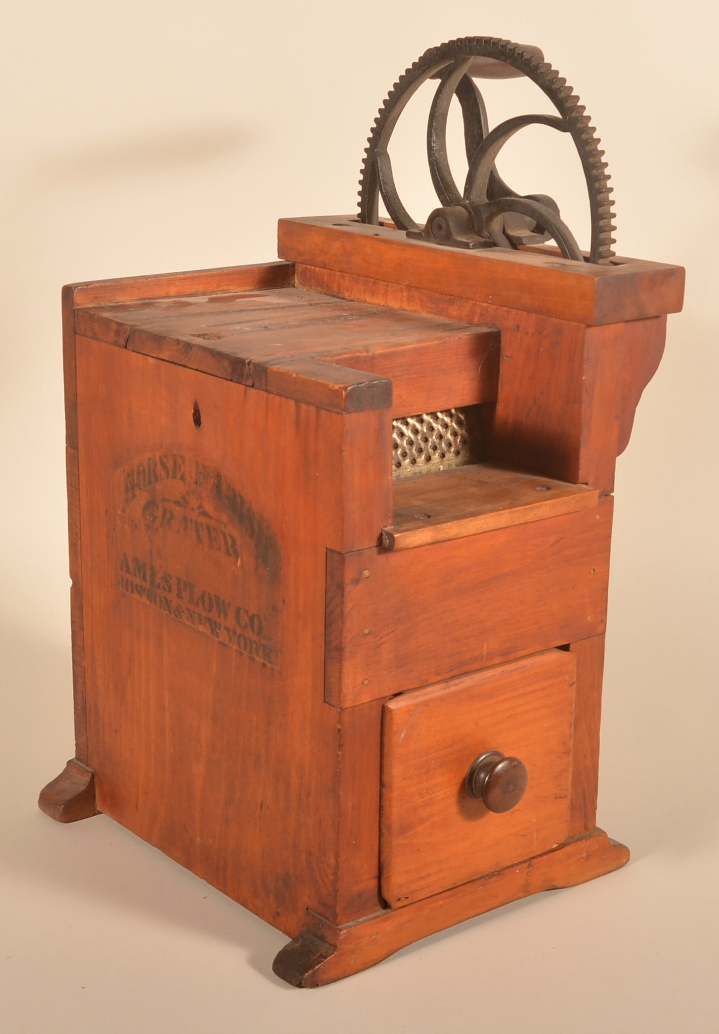 Early Ames Plow Co. Horse Radish Commercial Grater: Unusual large-size horseradish mechanical grater made by the Ames Plow Co. and stenciled on the side. Large pull-out drawer is round nailed. Ca. 1880-1900. The grater is complete. 26"H x 17"W x 15"D