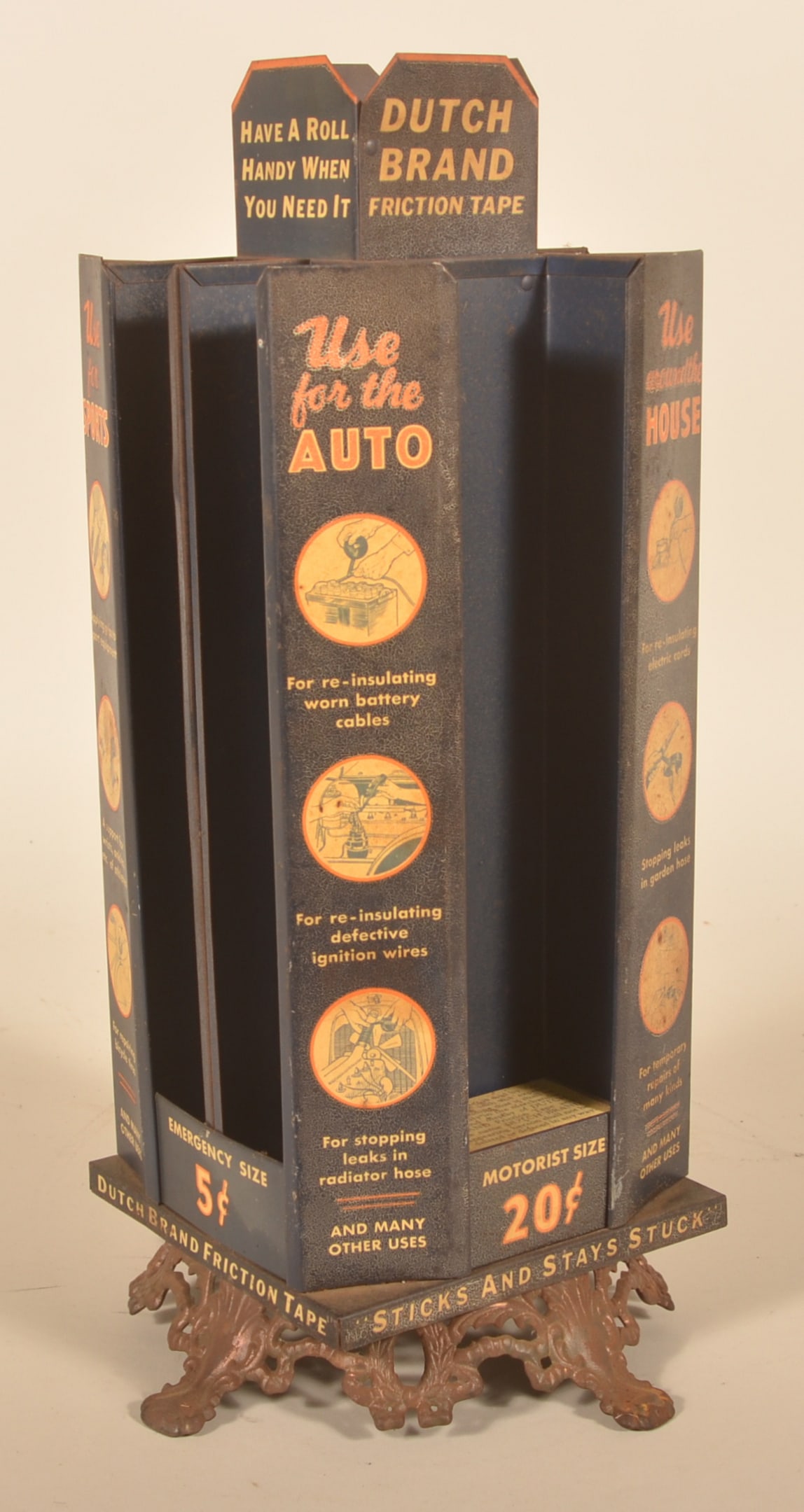 Dutch Brand Friction Tape Rotating Counter Display: Tin lithographed display on cast iron base advertising the many uses for their friction tape. For use on automobiles, bikes, injuries and handles of sports equipment. 1920s period. Provenance: The col