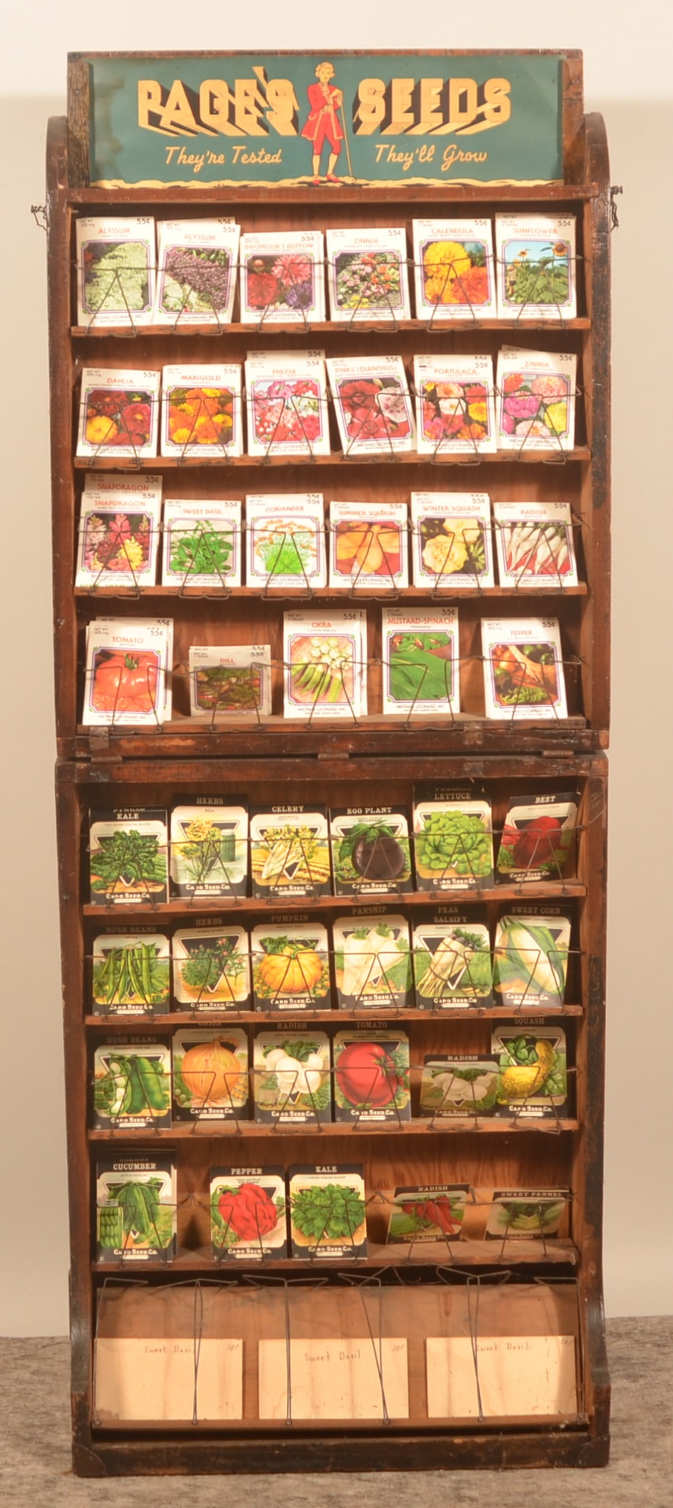Excellent Page's Seed Display: Traveling display that could fold when in transport or storage and then open to display the product with wire keepers and seed bags. Provenance: The collection of Russell and Darlene Snyder. 59"H x