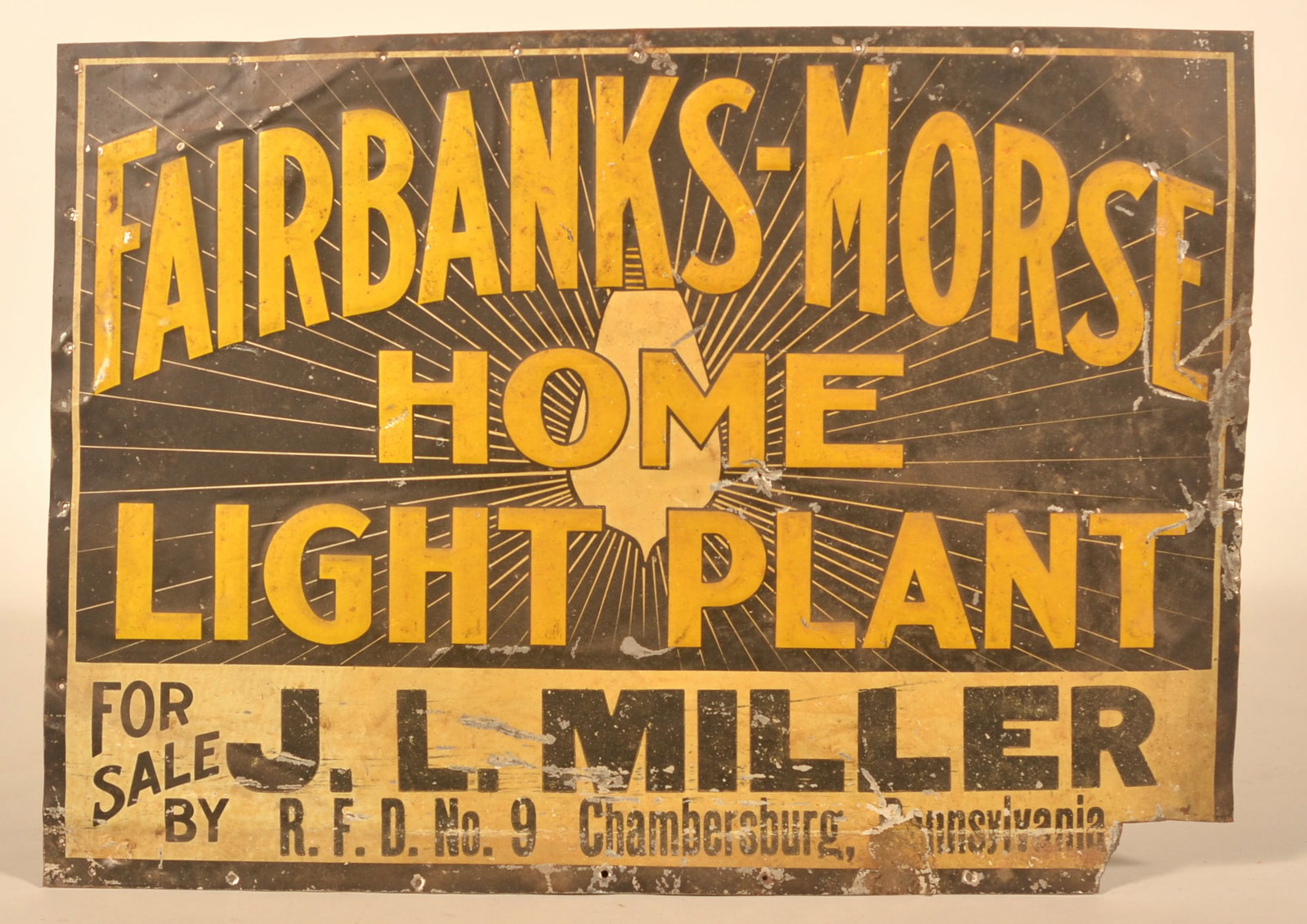 Embossed SST Fairbanks Morse Home Light Plant Sign: Early single-sided tin sign. Privilege panel filled out for J.L. Miller, RFD No.9 in Chambersburg, Pa. Provenance: The collection of Russell and Darlene Snyder. 13 3/4"H x 19"W