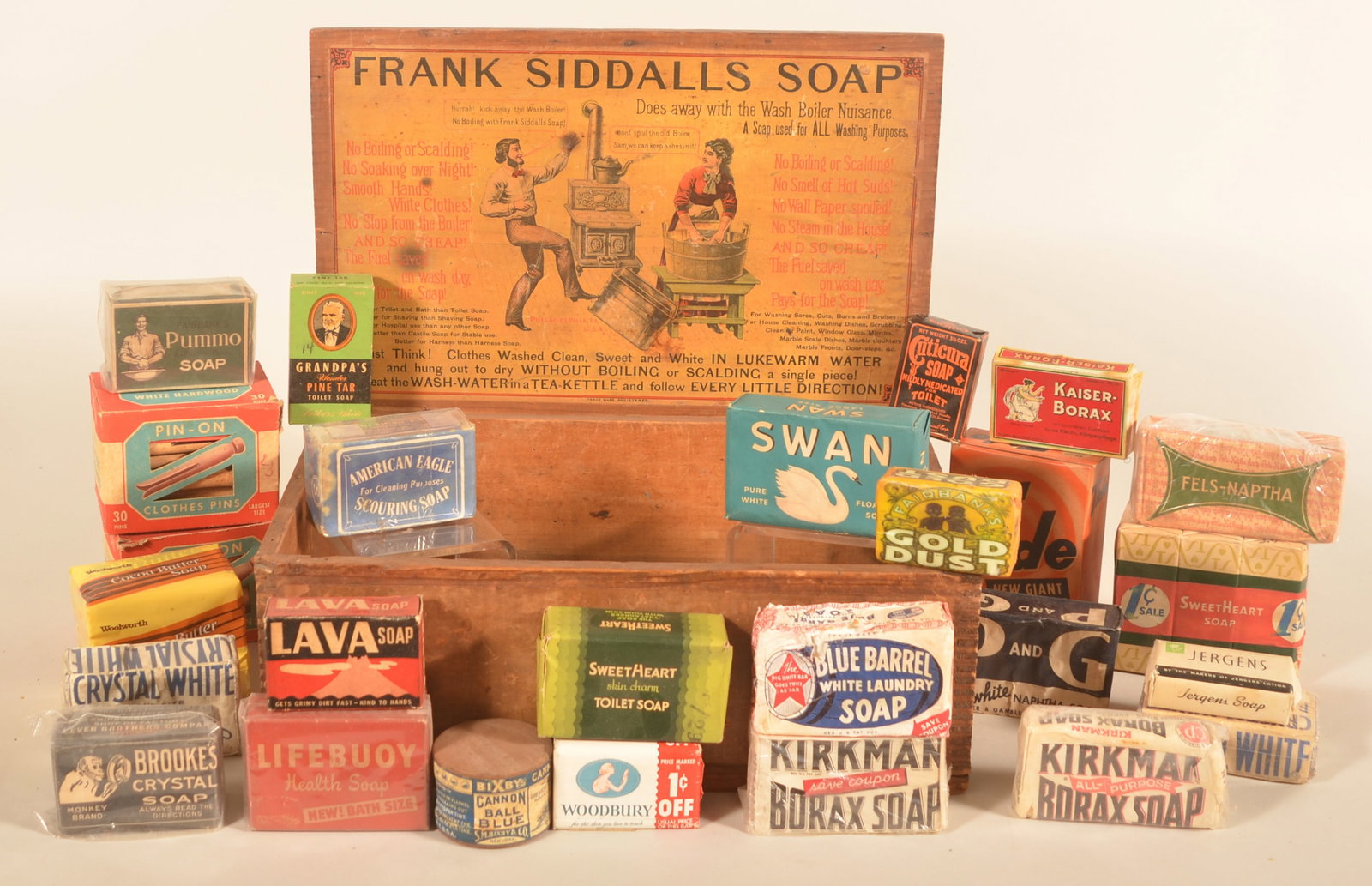 Frank Siddalls Wood Soap Display w/ Products: Dovetailed box with interior paper advertising label in very good condition. Display box comes with a wonderful collection of different brands of soap and two full boxes of wood clothespins. Provenanc