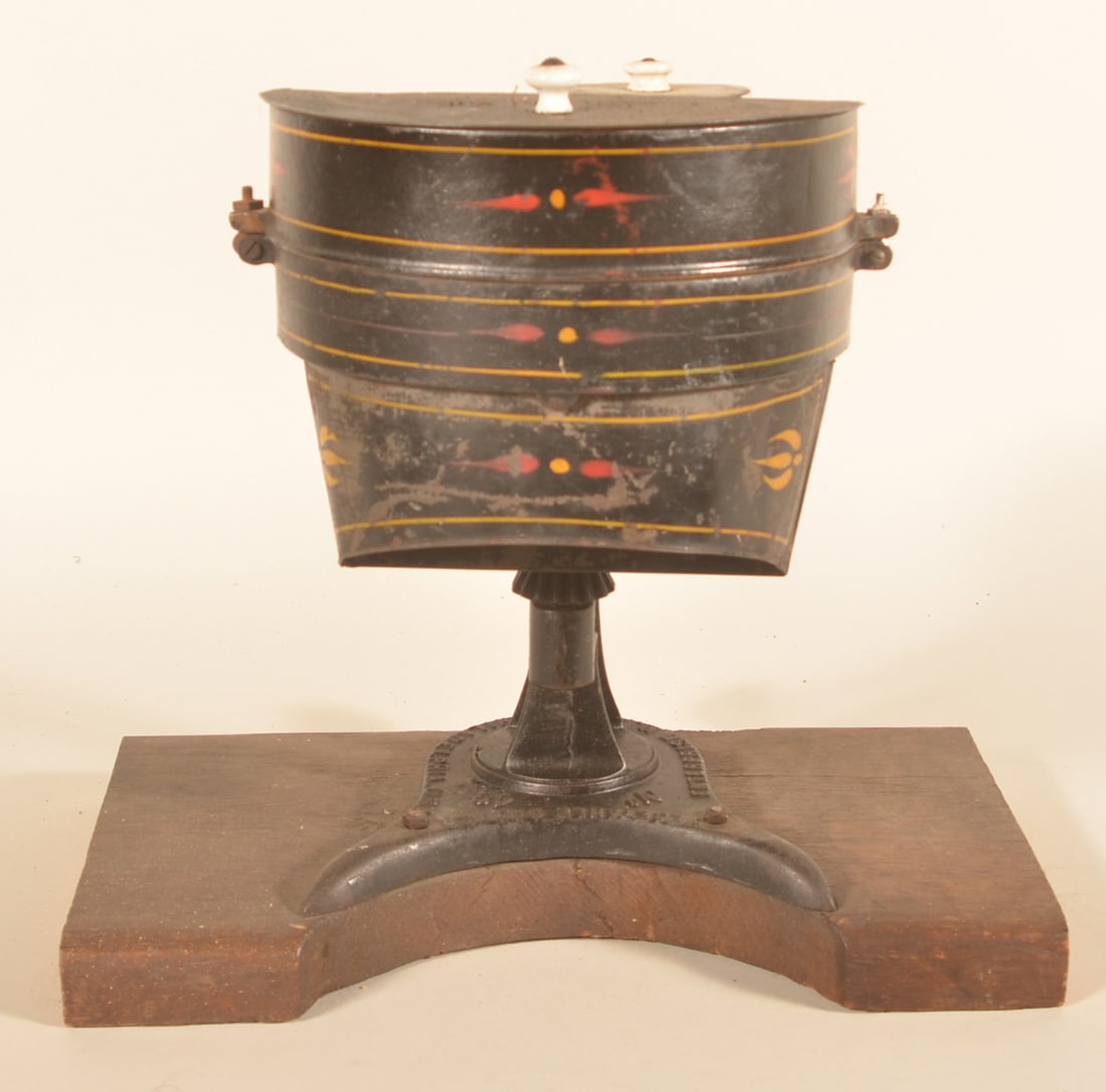 Enterprise No. 49 Cast Iron Store Vegetable Cutter: Excellent presentation, displayed on a thick oak board. Original black paint and pinstriping. Original product plunger on top. Provenance: The collection of Russell and Darlene Snyder. Without board,