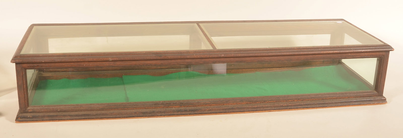 Antique Countertop General Store Display Case: Great size early-20th century oak and glass display case. Two sliding doors in back, original alligatored finish. Provenance: The collection of Russell and Darlene Snyder. 8 1/2"H x 47 1/2"W x 15"D