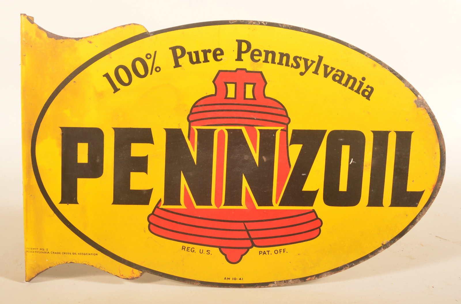 1941 Double-Sided Tin Pennzoil Flange Sign: Sign marked "A M 10-41" on bottom along with "Permit No 2 Pennsylvania Grade Crude Oil Association". Iconic brand logo featuring the Liberty Bell. Provenance: The collection of Russell and Darlene Sny