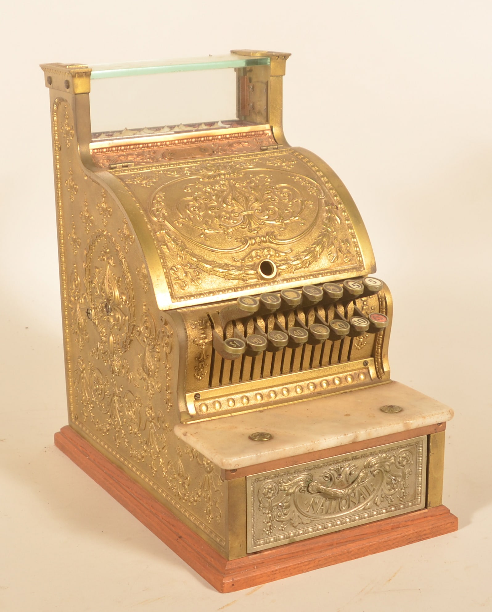 Model 313 Brass National Cash Register: Desirable $1 machine with matching serial numbers on the plate and drawer. Dated 3-9-1911, it was sold to the McNair Drug Company in Tarboro, North Carolina. Provenance: The collection of Russell and