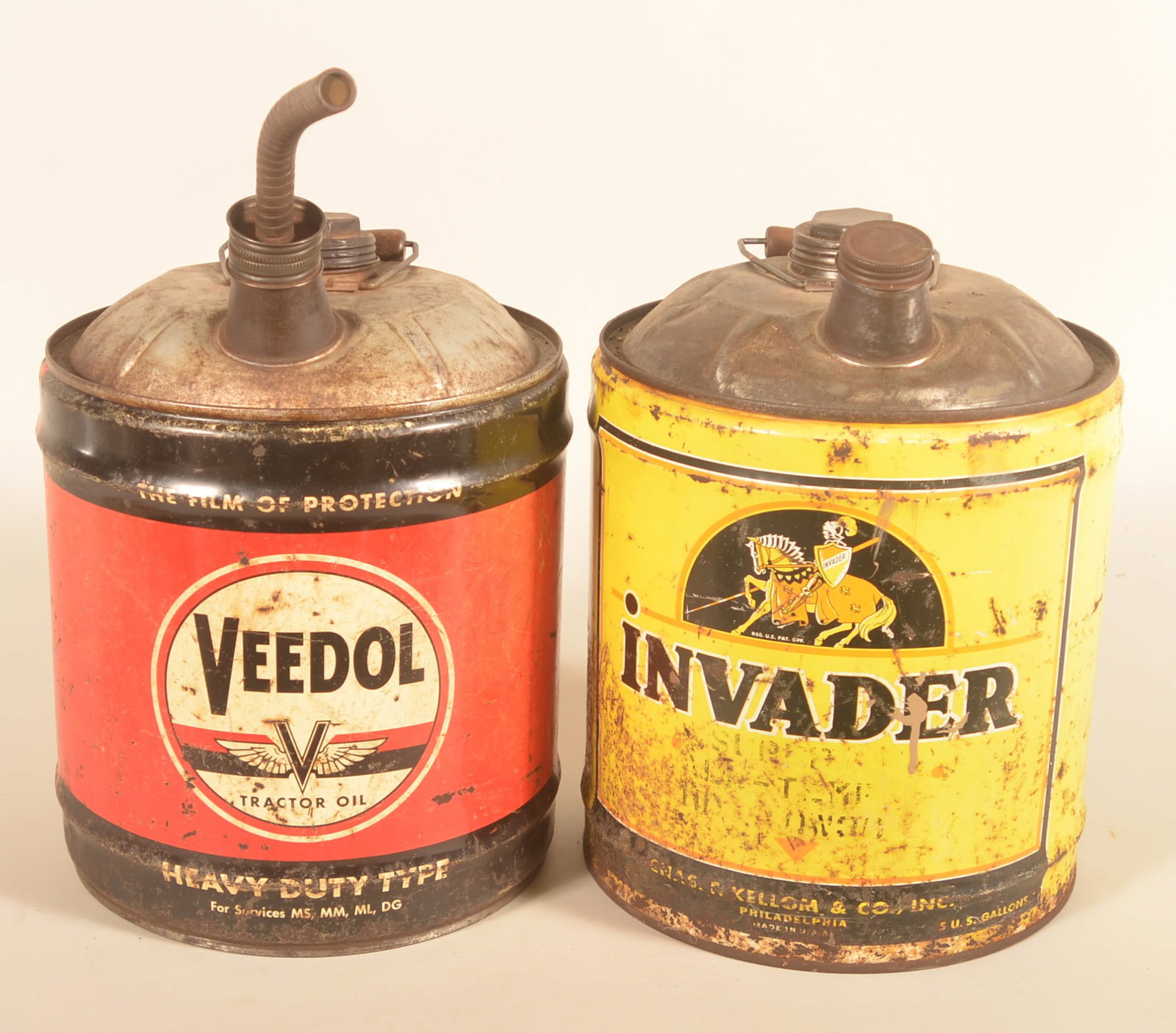 Veedol & Nourse Invader 5-Gallon Oil Cans: Bail-handled tractor oil cans with good colors and graphics. Provenance: The collection of Russell and Darlene Snyder. Each, 15"H