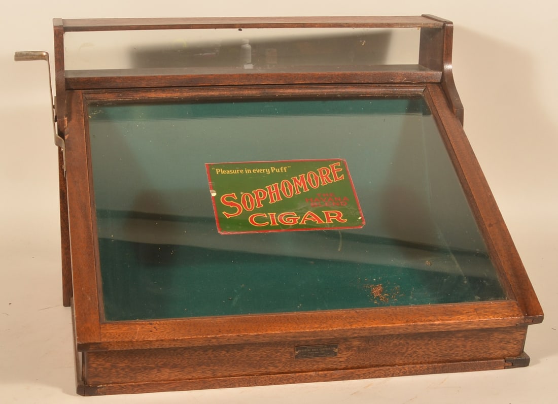 Excellent Sophomore Cigar Oak Counter Display Case: Great form and impressive display. The slanted front lifts and as it does, the inside body raises with it so you can easily grab your preferred cigar. There is a narrow display area across the top