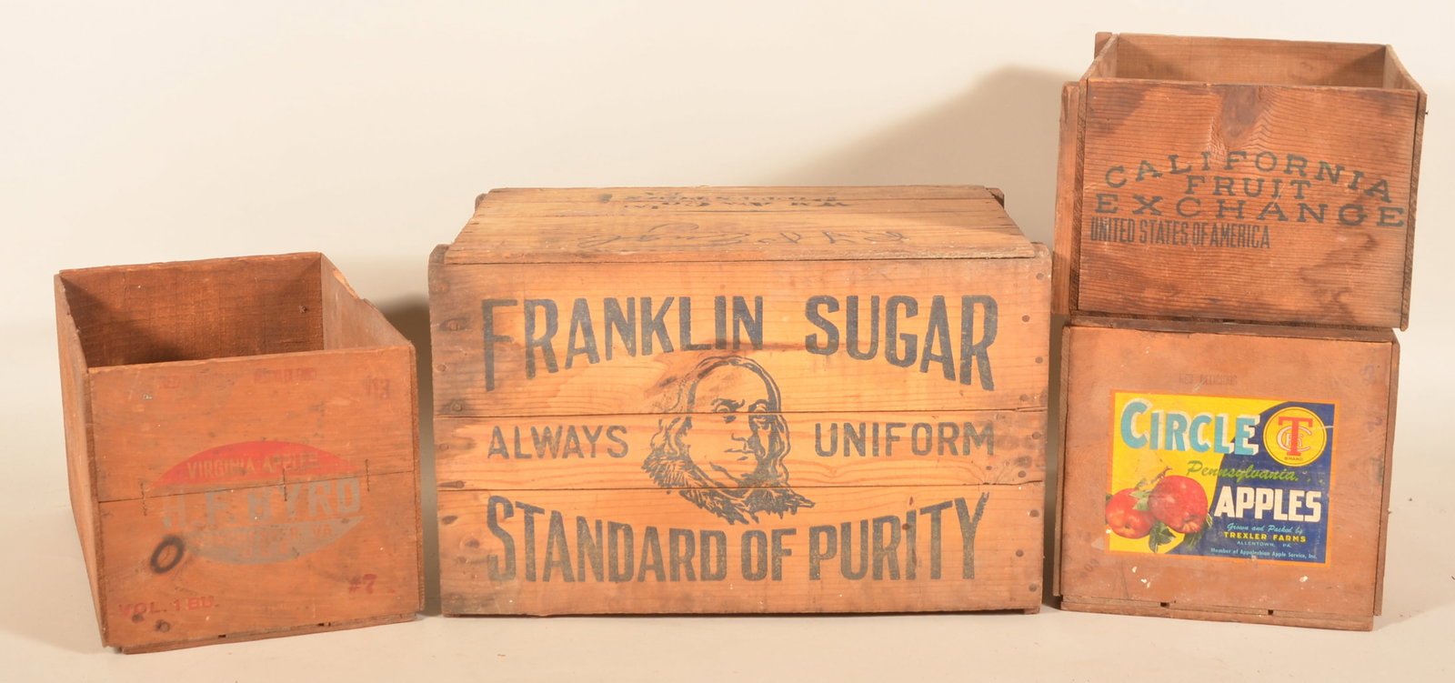 Group Wood Labeled Advertising Shipping Crates: Four advertising crates including Ben Franklin sugar crate, California Fruit Exchange, Pennsylvania Circle Apples and Virginia Apples. Franklin crate, 14"H x 23"W x 13 1/2"D