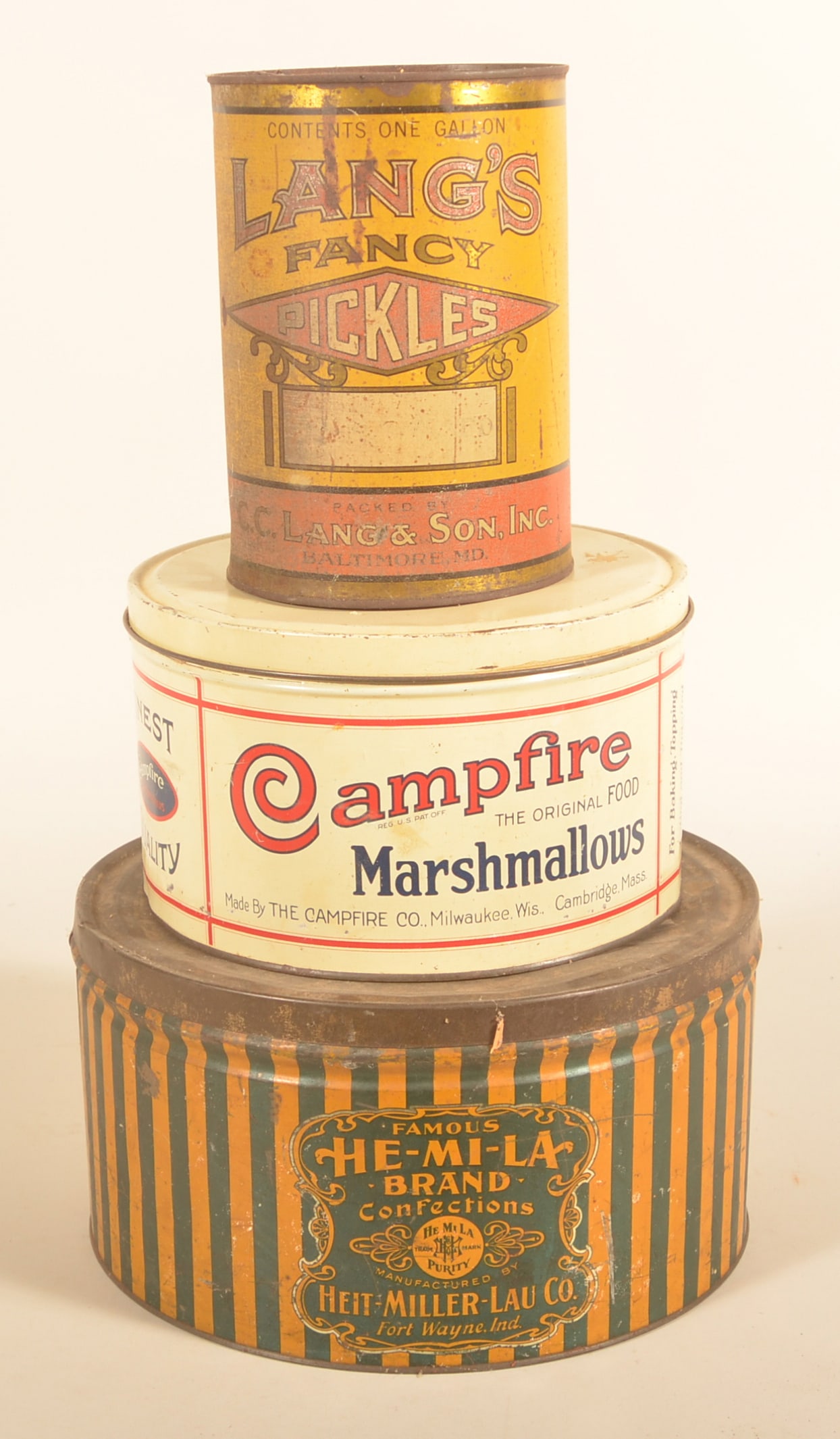 Stack of Vintage Advertising Tins: Nice stack including a Campfire Marshmallow, He-Mi-La confections and a rare Lang's Fancy Pickles from Baltimore, MD. Provenance: The collection of Russell and Darlene Snyder. Tallest, 8 3/4"H