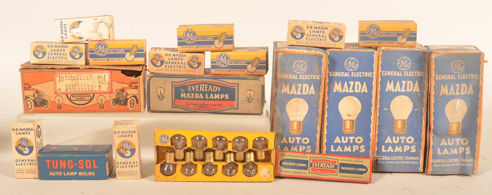 Group Westinghouse Auto & Eveready Light Bulbs: Nice early Westinghouse cardboard automobile lamps box with some product. Other boxes of old store stock. Provenance: The collection of Russell and Darlene Snyder. Westinghouse, 3 1/4"H x 8 1/4"W x 3 