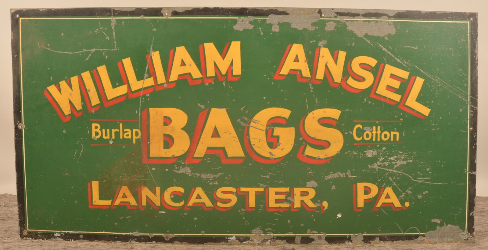 Excellent William Ansel Lancaster Advertising Sign: Large single-sided metal sign in the original colorful paint advertising "William Ansel Burlap/Cotton BAGS Lancaster, Pa". 1920s era. Provenance: The collection of Russell and Darlene Snyder. 30"H x 6