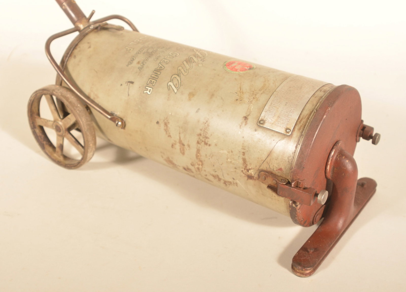 Regina Model F Pneumatic Vacuum Cleaner: Another very nice example of an early vacuum, this one in the original condition. Maker mark on the tank. Provenance: The collection of Russell and Darlene Snyder. 35"H x 52"L with handle