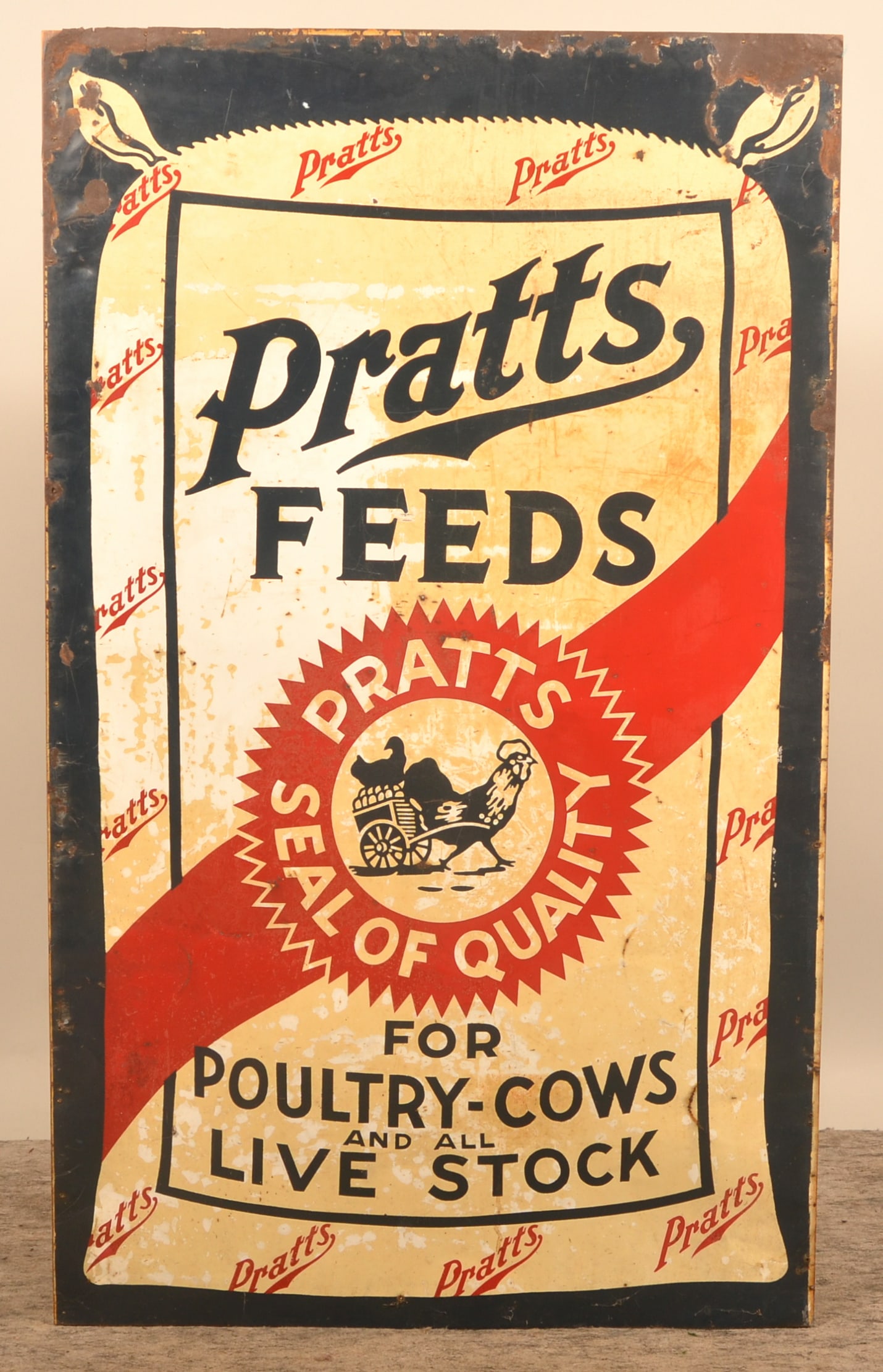 Large Single-Sided Tin Pratts Poultry Feed Sign: Uncommon, large vertical tin sign from the Pratts company in Philadelphia, Pa. Image of a feed bag with the Pratts logo of a rooster hauling a chicken with her eggs in a cart. Red, white, and blue col