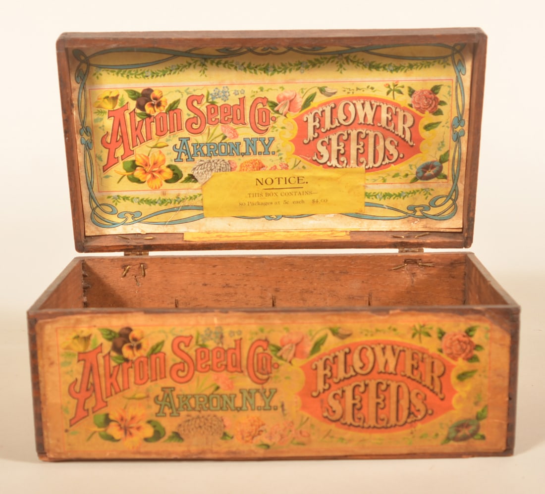 Akron Seed Co. Paper Label Seed Box: Excellent example with colorful labels on the front and inside of lid. From Akron, NY. Provenance: The collection of Russell and Darlene Snyder. 4"H x 10"W x 5 1/2"D