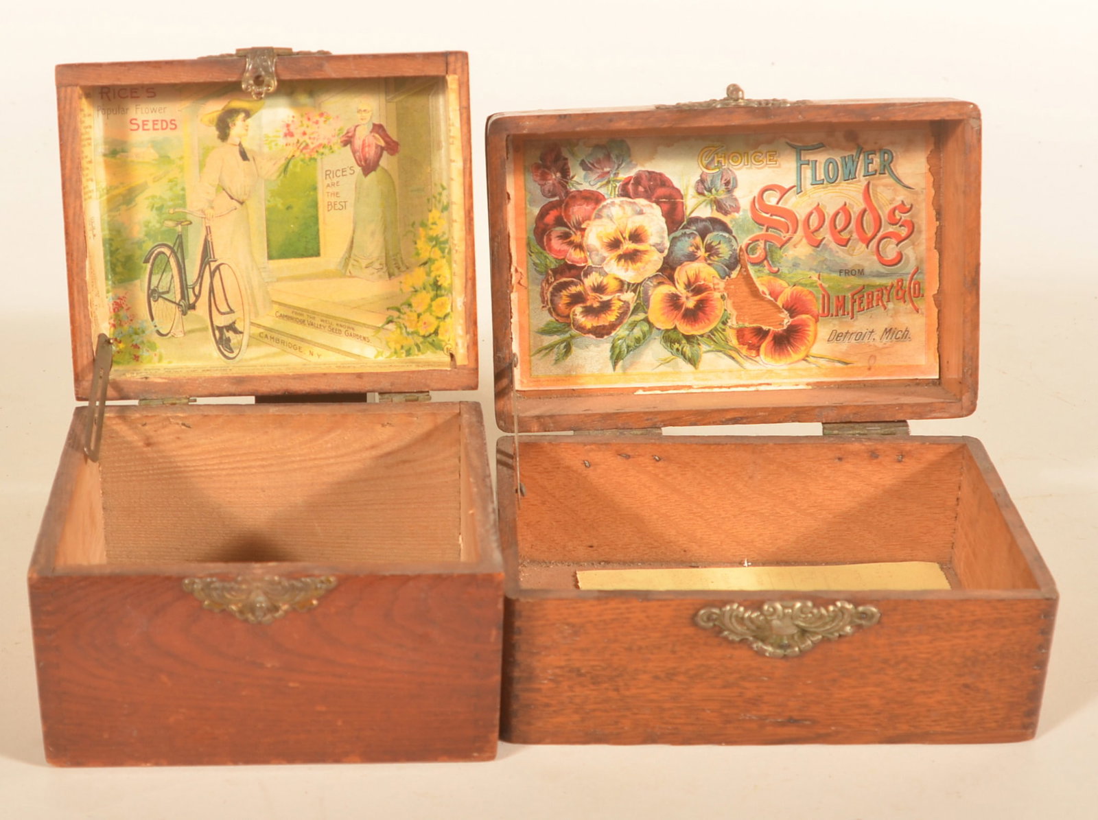 Two Small Rice's Flower Seed Display Boxes: Two small oak boxes with colorful interior labels. From DM Ferry & Co., Detroit, MI. Provenance: The collection of Russell and Darlene Snyder. Smaller box, 4"H x 6"W x 5"D