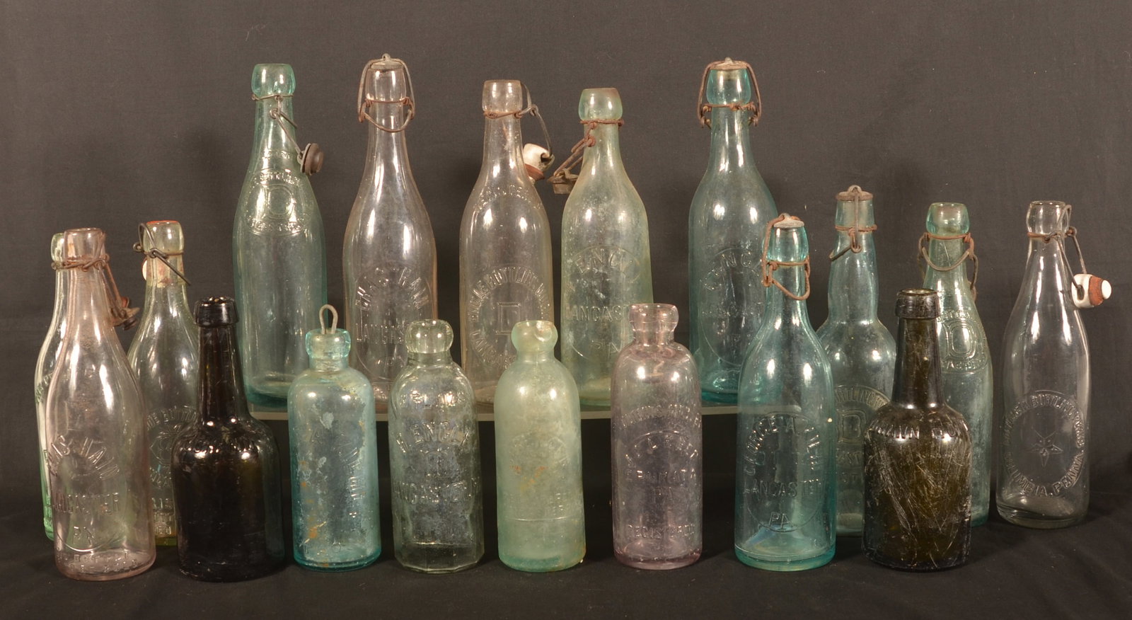 Collection of Lancaster, PA Beer & Soda Bottles: Large collection of eighteen bottles including seven Engle Bottling Works, two Johann Hoff (green and amber) bottles, Ingleside Bottling Co, two Chas Hain, Leber (Ephrata), Prengler, J/S Lancaster,