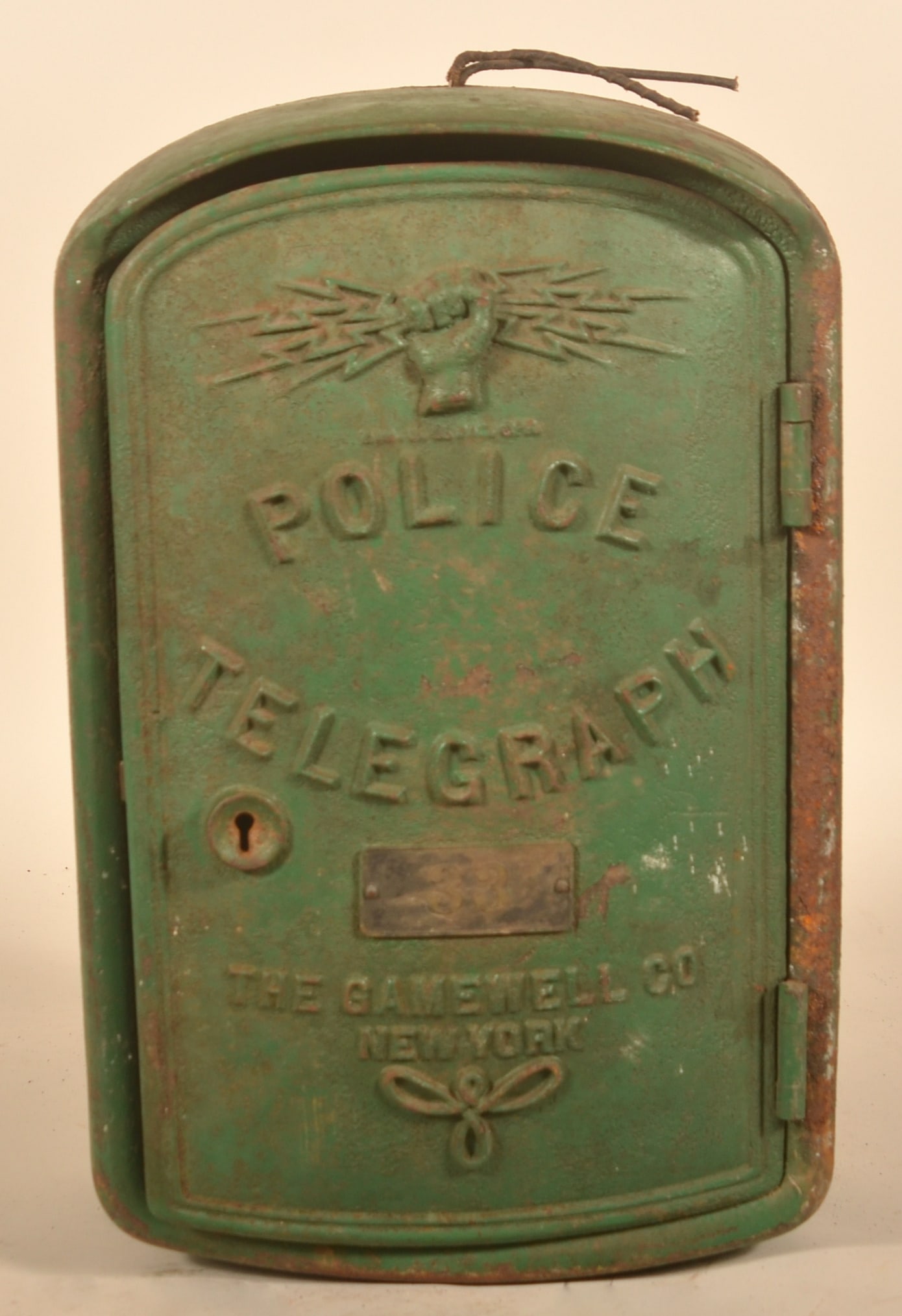 Gamewell Company Cast Iron Police Telegraph Box: Early cast iron call box with interior mechanism in an old green paint. Brass plaque with number "33", possibly from Latrobe, Pa. considering the green and the number. 19 1/2"H x 13"W x 8"D