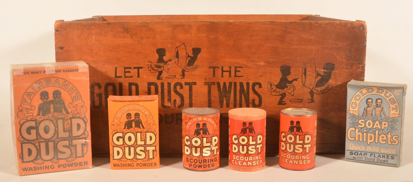Gold Dust Washing Powder Crate & Packages: Very nice wood shipping crate with graphics on all four sides. Together with the rarer blue package, two different size orange boxes and three different canisters. Boxes and canisters are unopened. Pr