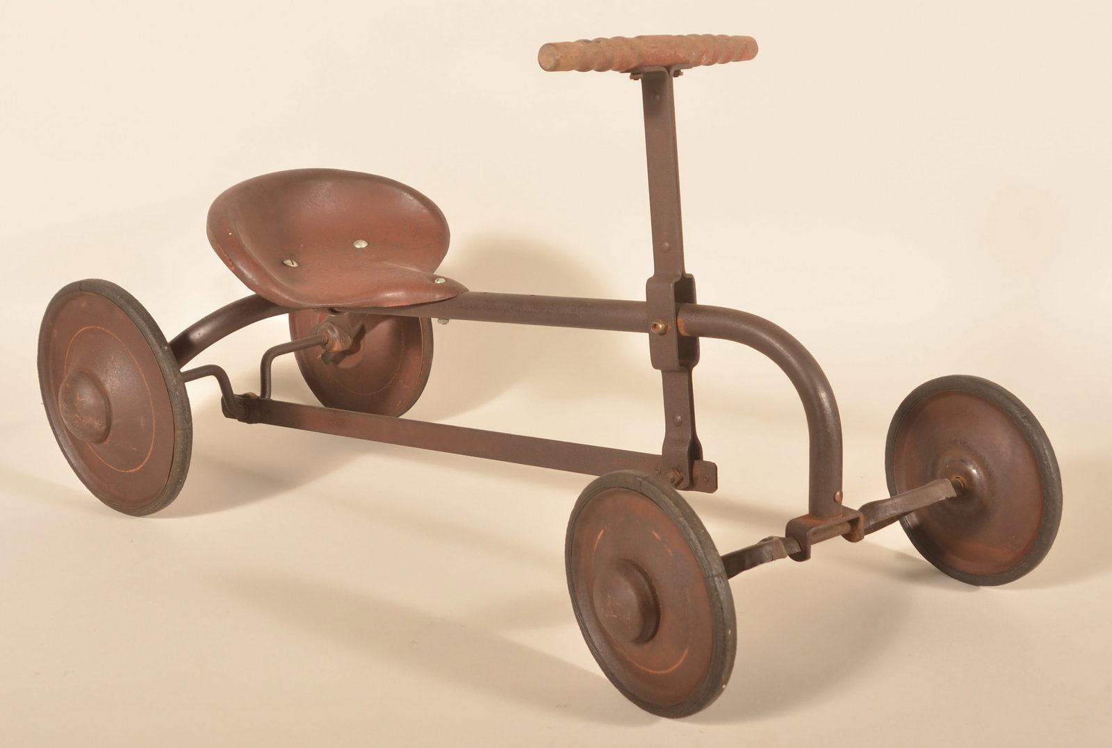 Antique Metal "Irish Mail" Push/Pull Cart: 1920s child riding toy with solid steel body, solid rims and rubber tires. Provenance: The collection of Russell and Darlene Snyder. 33"L