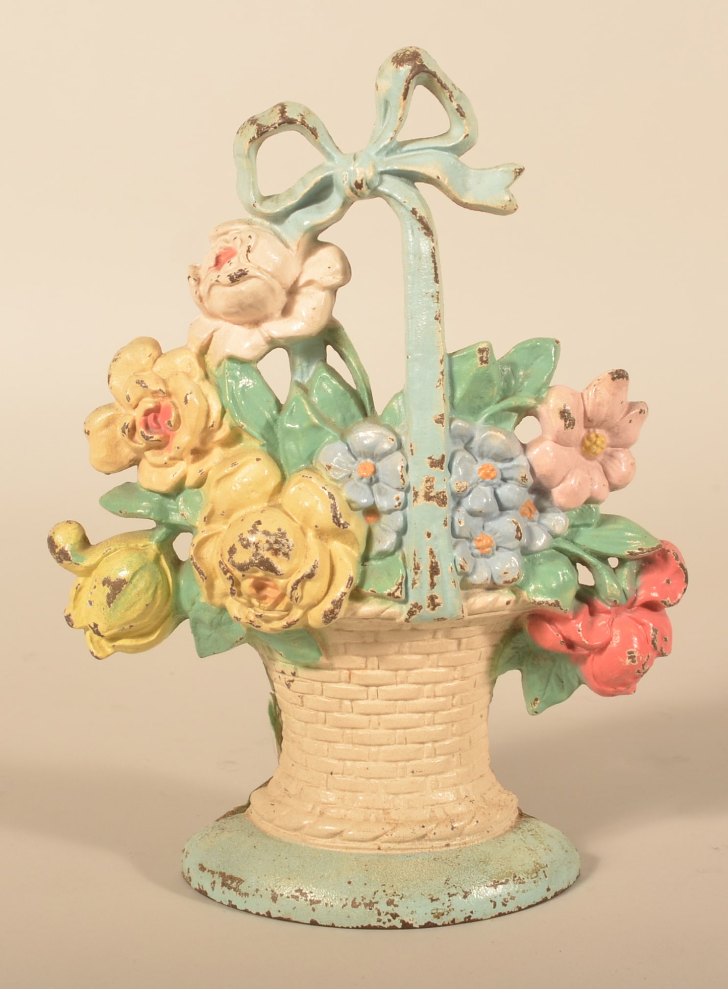 Hubley Basket of Flowers Cast Iron Doorstop: Excellent example with bright, original paint. 10 3/4"H