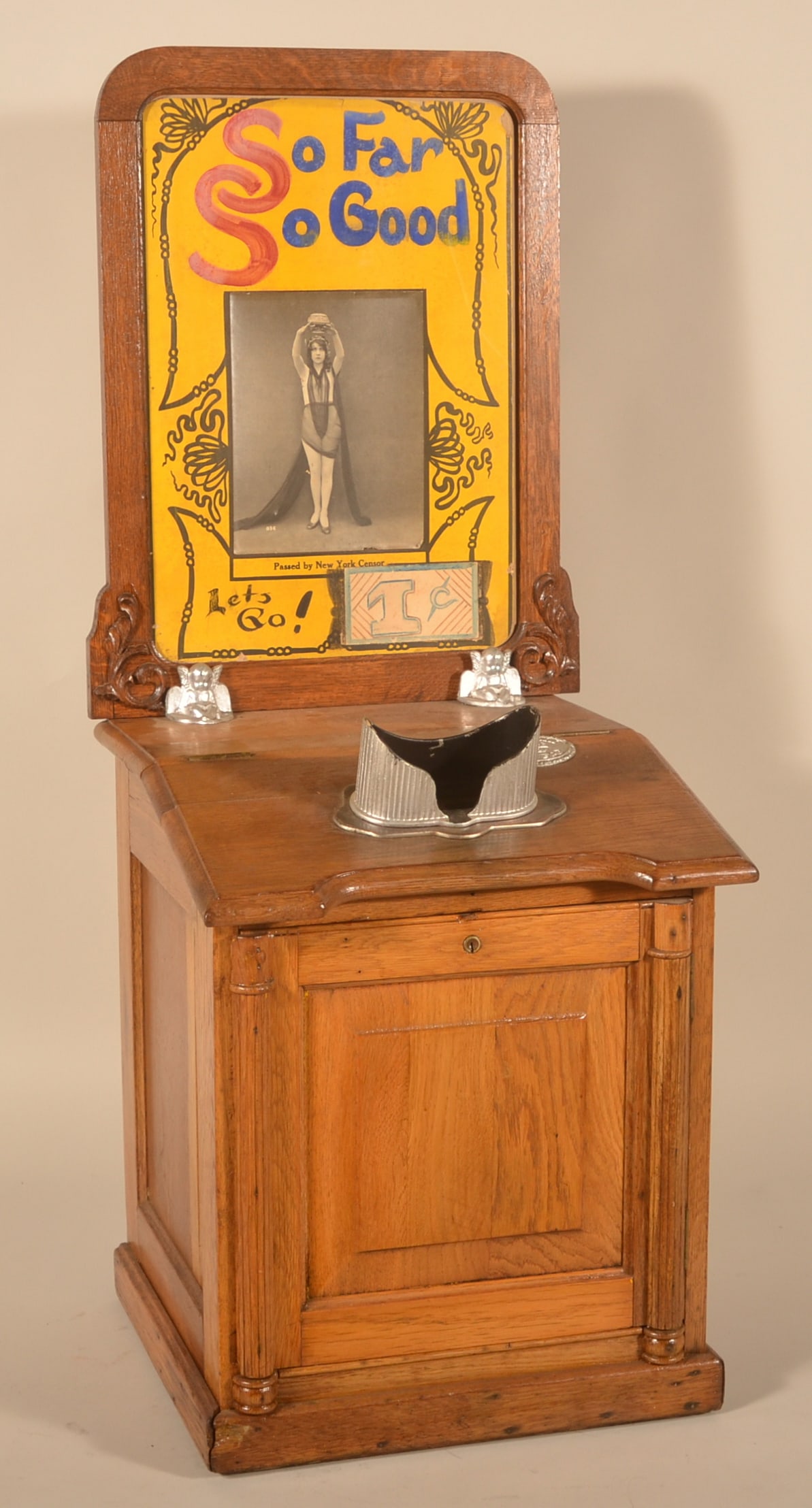 Antique Coin-Op Arcade Stereo Viewer: Coin-operated machine utilizing a 3D stereoscopic viewer to display a series of stereoview flip cards that rotate when a coin is inserted. An electric light bulb provides the light. The marquee with