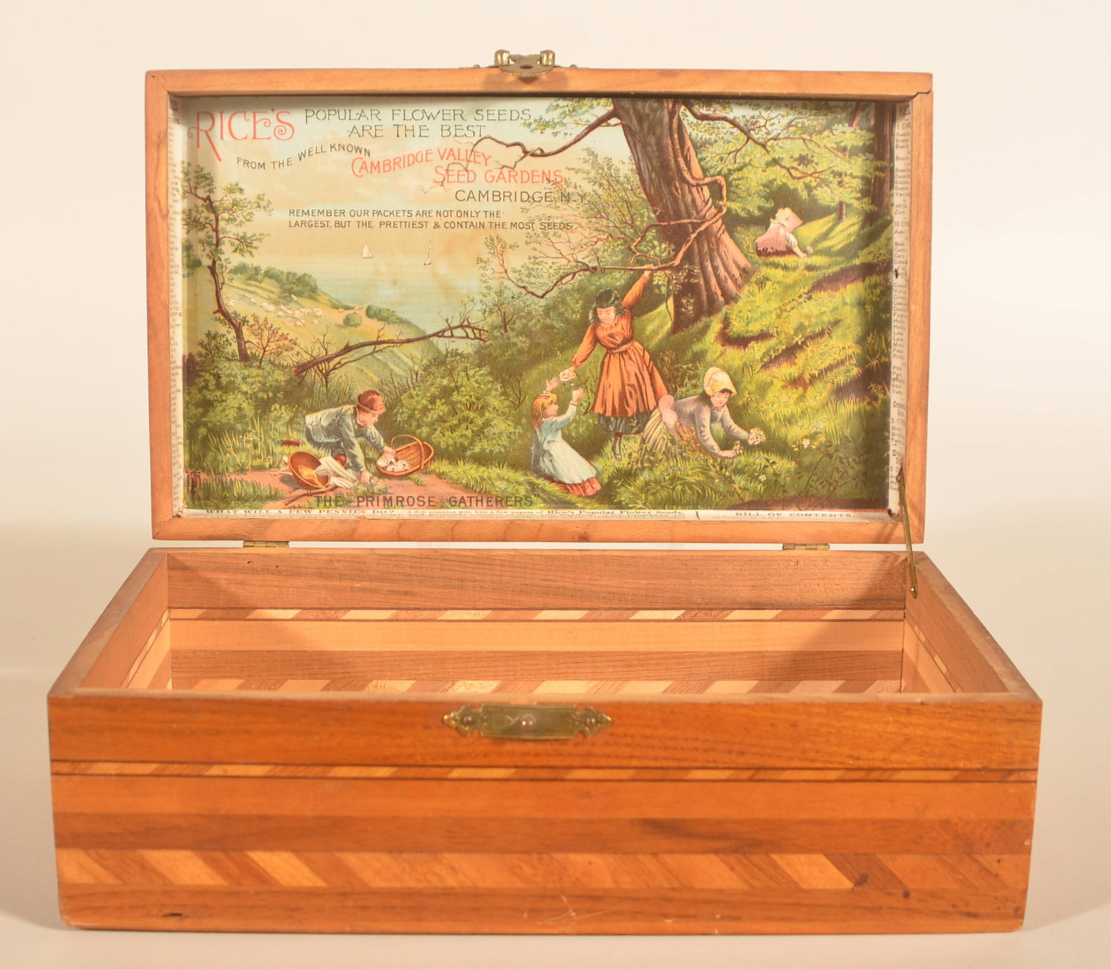 Rice's Flower Seed Display Box w/ Excellent Label: Interesting marquetry inlaid box with striking interior label showing young boys and girls picking flowers. Litho is titled "The Primrose Gatherers". Provenance: The collection of Russell and Darlene