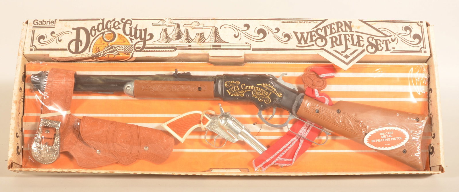 Vintage Gabriel Dodge City Western Rifle Set: NOS in the box based on the 1873 Winchester. Provenance: The collection of Linda and the late Ed Althouse. 12"H x 30 1/2"W