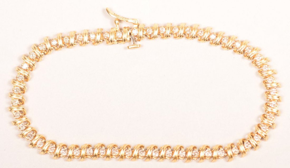 10 KT DIAMOND BRACELET 9.0 GRAMS 1 CTW 7 1/2 INCHES: 10 KT DIAMOND BRACELET 9.0 GRAMS 1 CTW 7 1/2 INCHES LENGTH