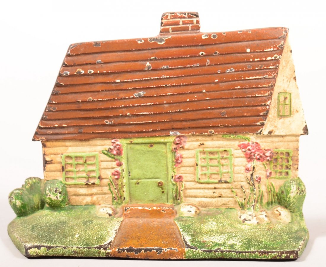 124. Painted Cast Iron Cottage Doorstop with original: 124. Painted Cast Iron Cottage Doorstop with original paint, Unsigned,5-3/4"h.x 7-1/2"w. Conditon: Good.
