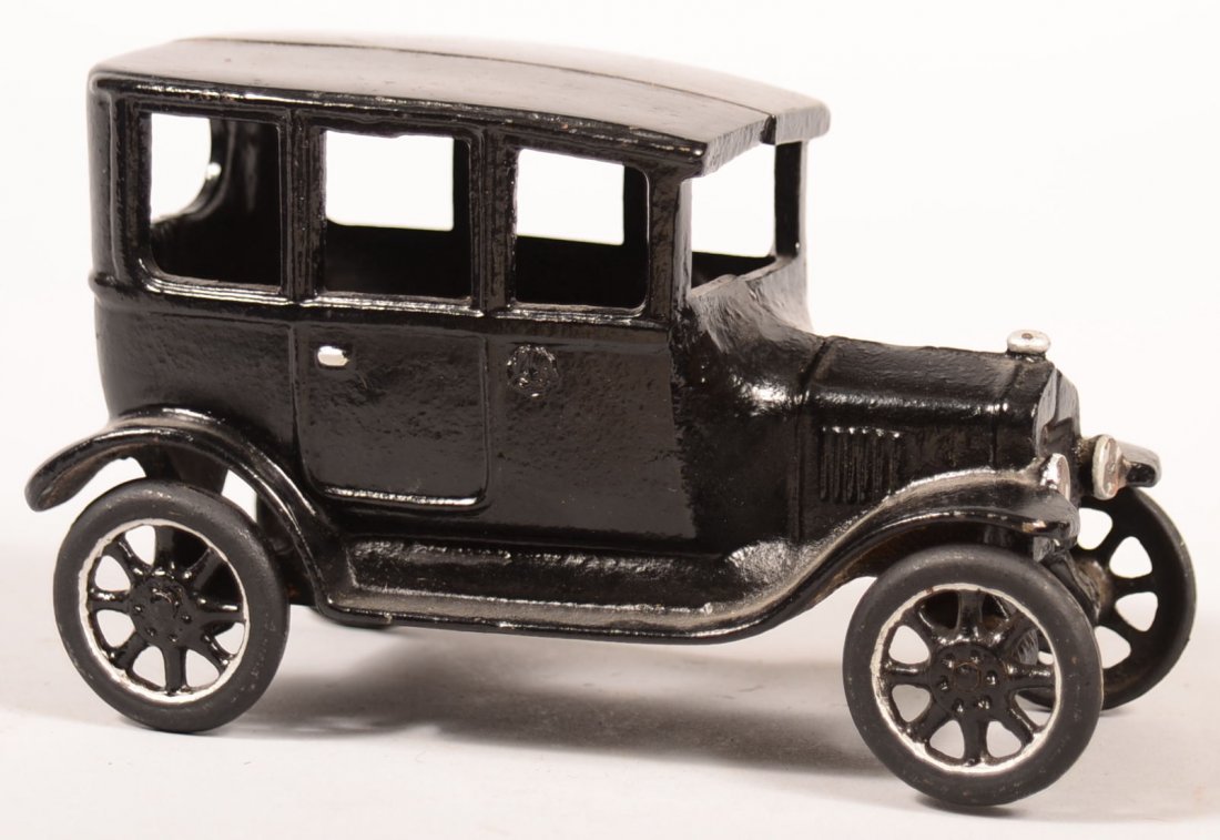 132. Signed Arcade Cast Iron Ford Tudor Sedan.: 132. Signed Arcade Cast Iron Ford Tudor Sedan. Repainted Black with silver highlights, 4"h.x 6-1/2"l. Condition: Repainted and missing driver.