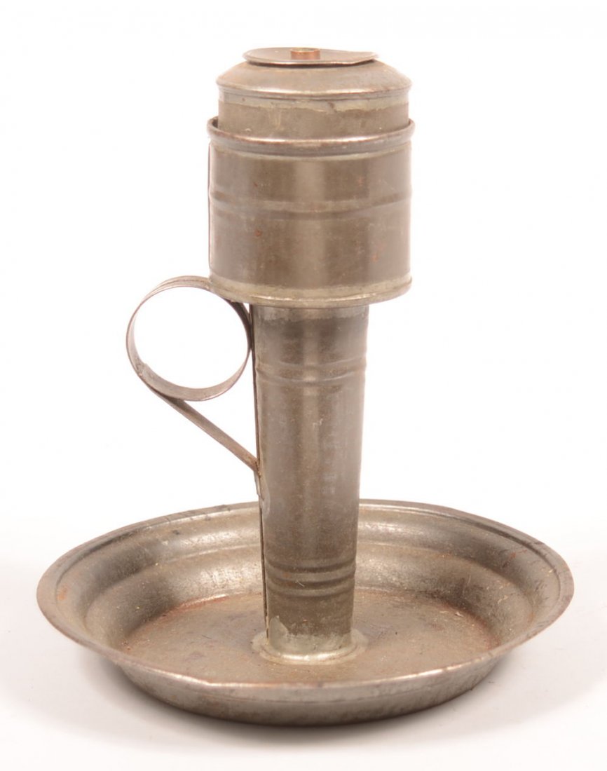 212. Tin Kettle Lard Lamp with Tidy. Cylindrical form: 212. Tin Kettle Lard Lamp with Tidy. Cylindrical form reservoir with wicker holder, tidy with cylindrical form top with rounded shaft and saucer base, folded and soldered joints, applied ring handle, 